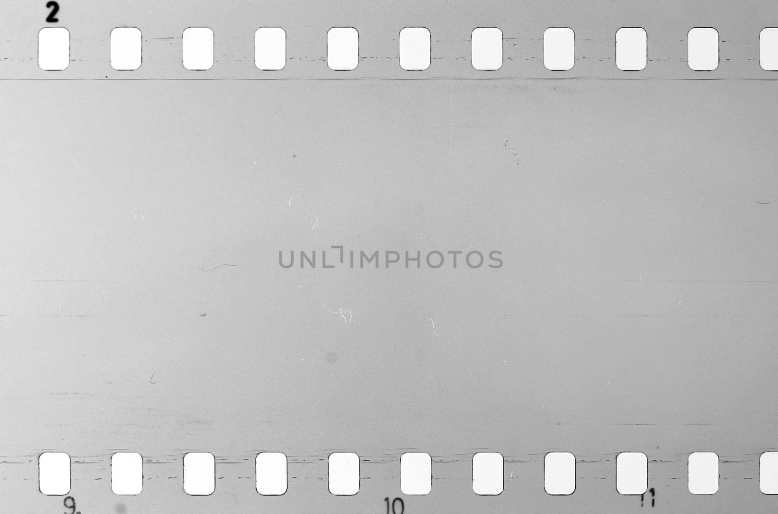 Old celluloid film strip with dust and scratches