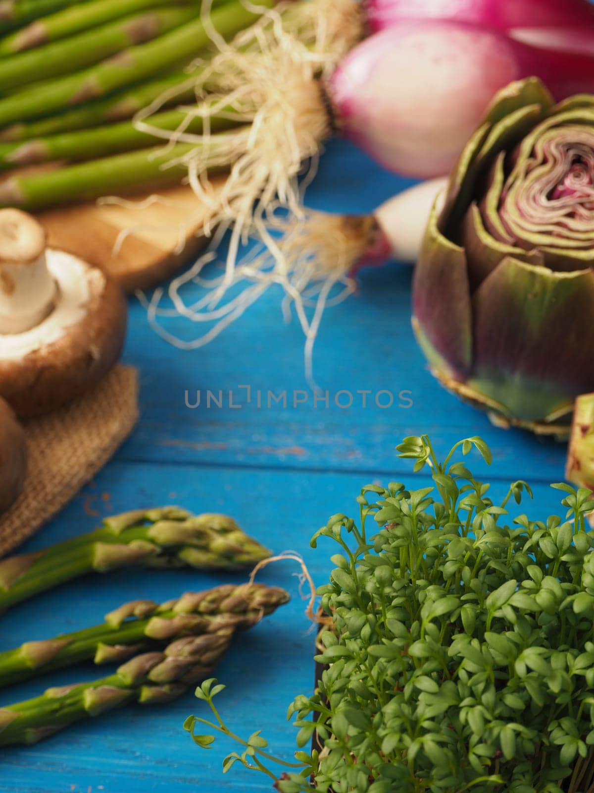 Healthy food concept with organic vegetables on a rustic wooden table, natural light with selective focus