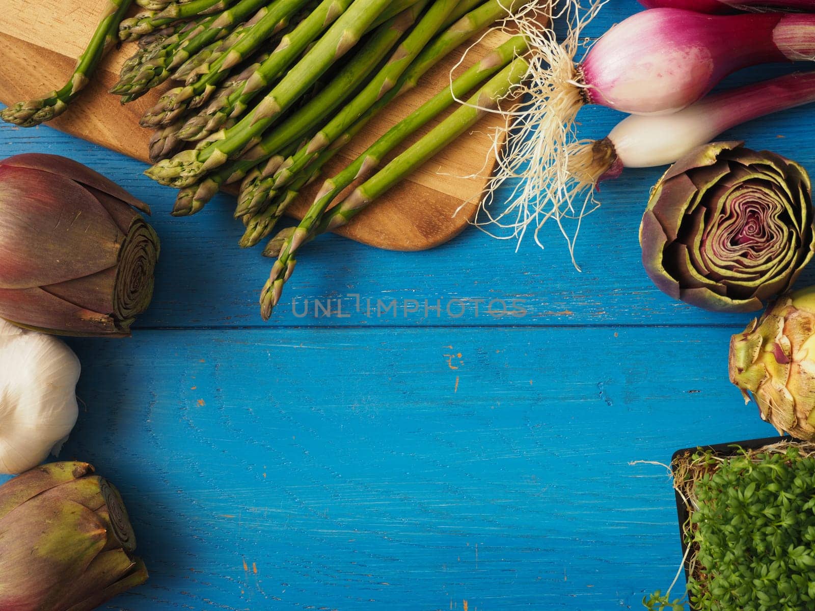 Healthy food concept with organic vegetables on a rustic wooden table, natural light with selective focus