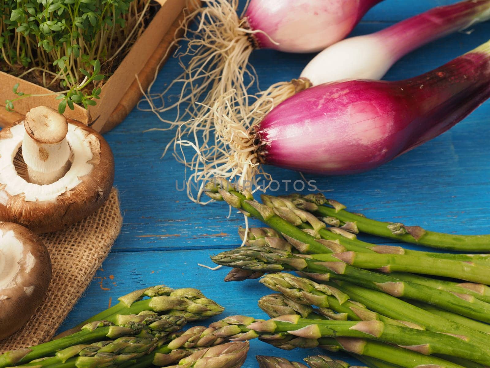 Healthy food concept with organic vegetables on a rustic wooden table, natural light with selective focus