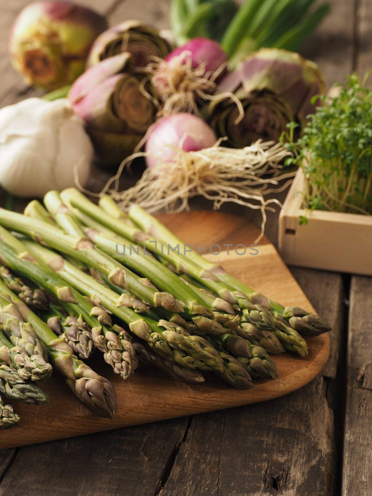 Healthy food concept with organic vegetables on a rustic wooden table, natural light with selective focus