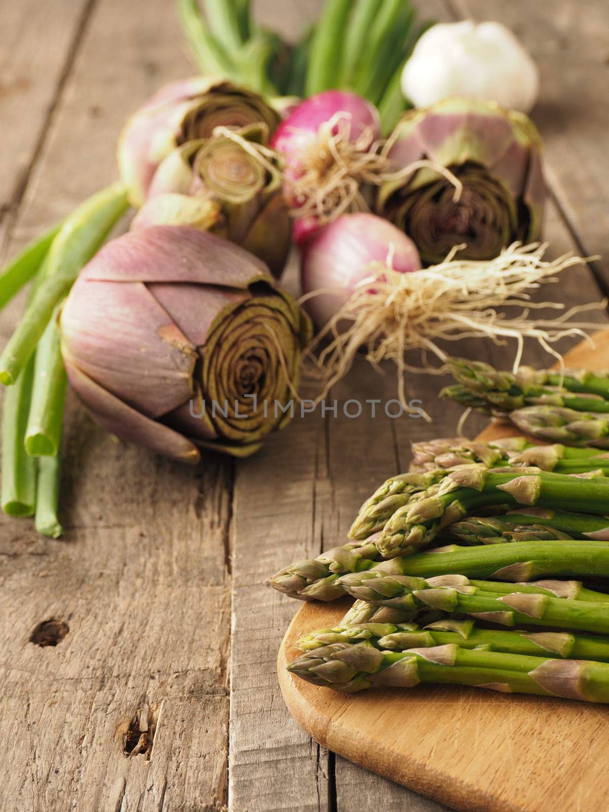 Healthy food concept with organic vegetables on a rustic wooden table, natural light with selective focus
