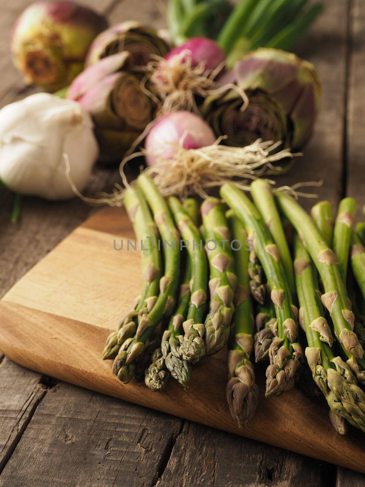 Healthy food concept with organic vegetables on a rustic wooden table, natural light with selective focus
