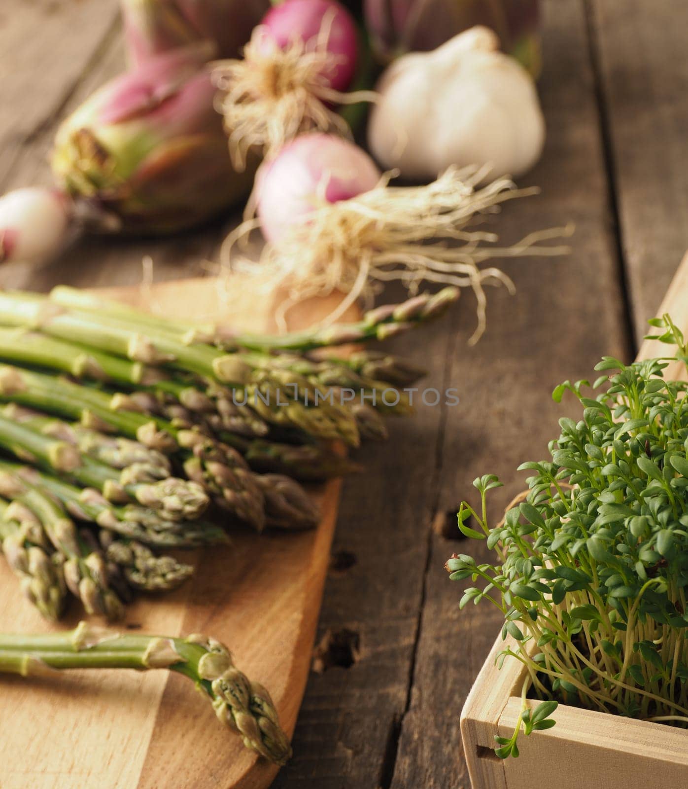 Healthy food concept with organic vegetables on a rustic wooden table, natural light with selective focus