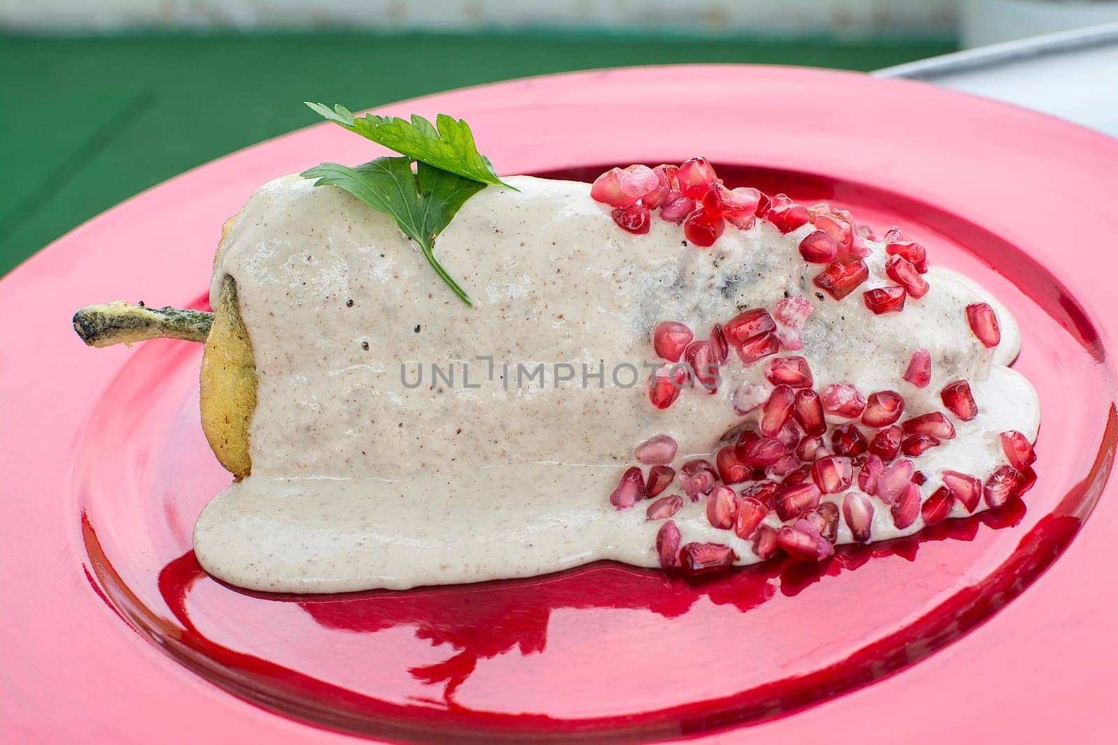 Chiles en nogada is a dish, served at room temperature with cold cream sauce, from Mexican cuisine.