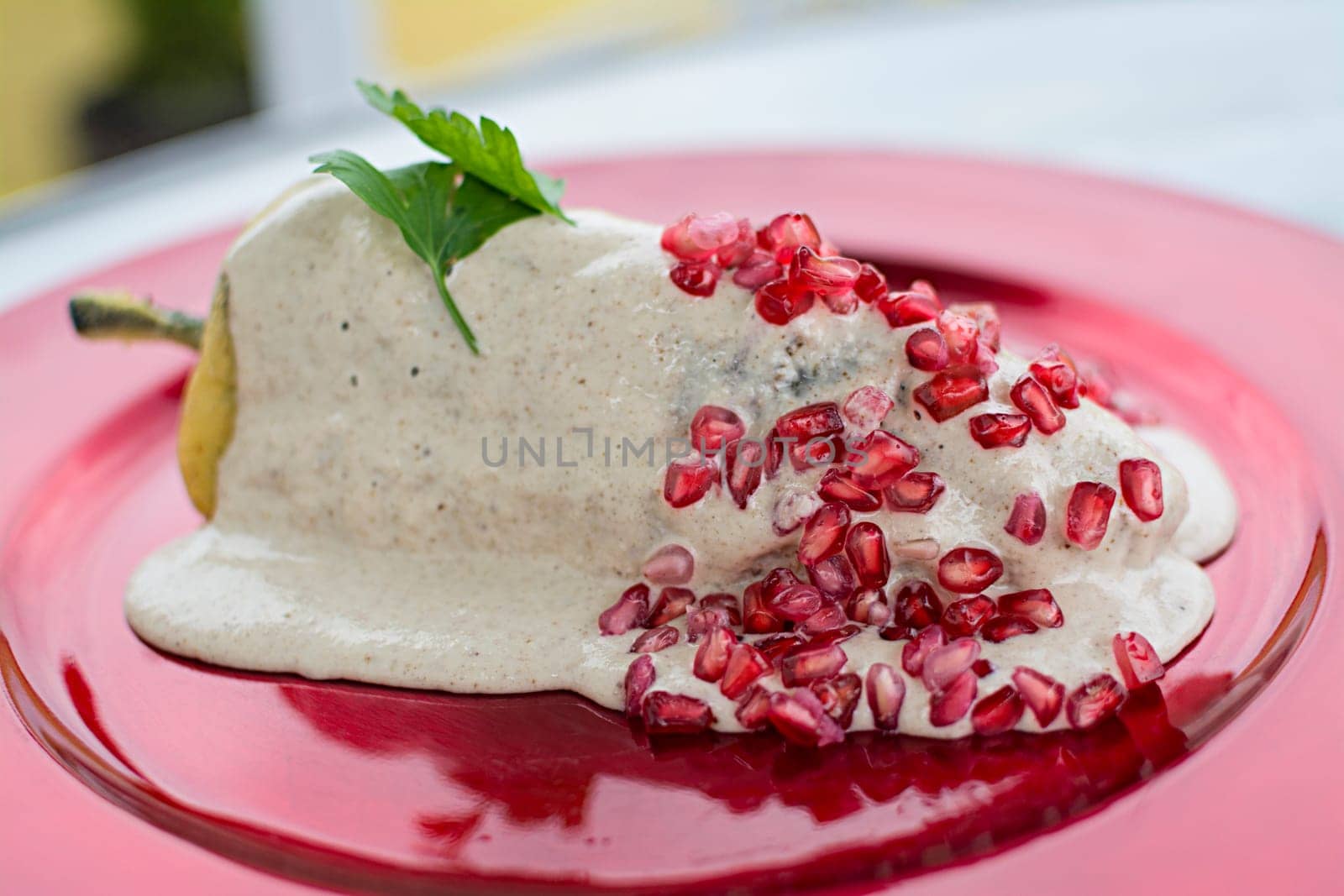 Chiles en nogada is a dish, served at room temperature with cold cream sauce, from Mexican cuisine.