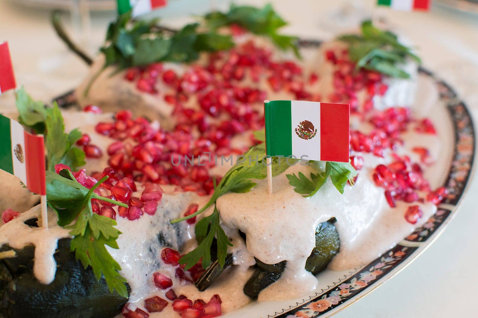 Chiles en nogada is a dish, served at room temperature with cold cream sauce, from Mexican cuisine.