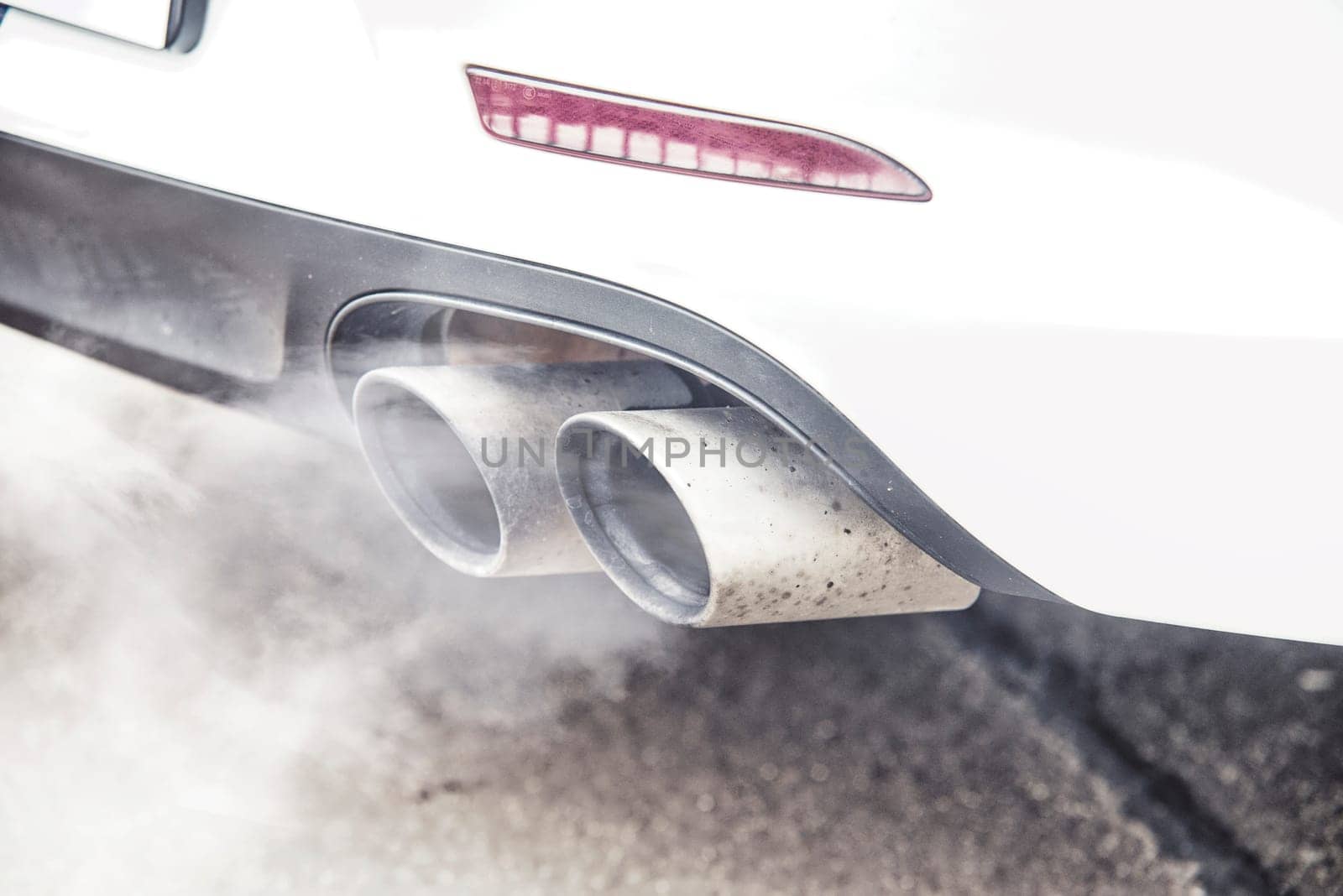 close up on pipe exhaust car smoke emission