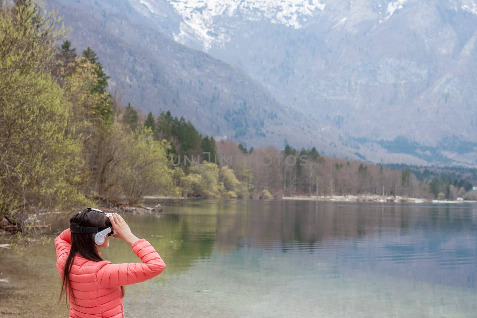 young woman in the nature with VR glasses