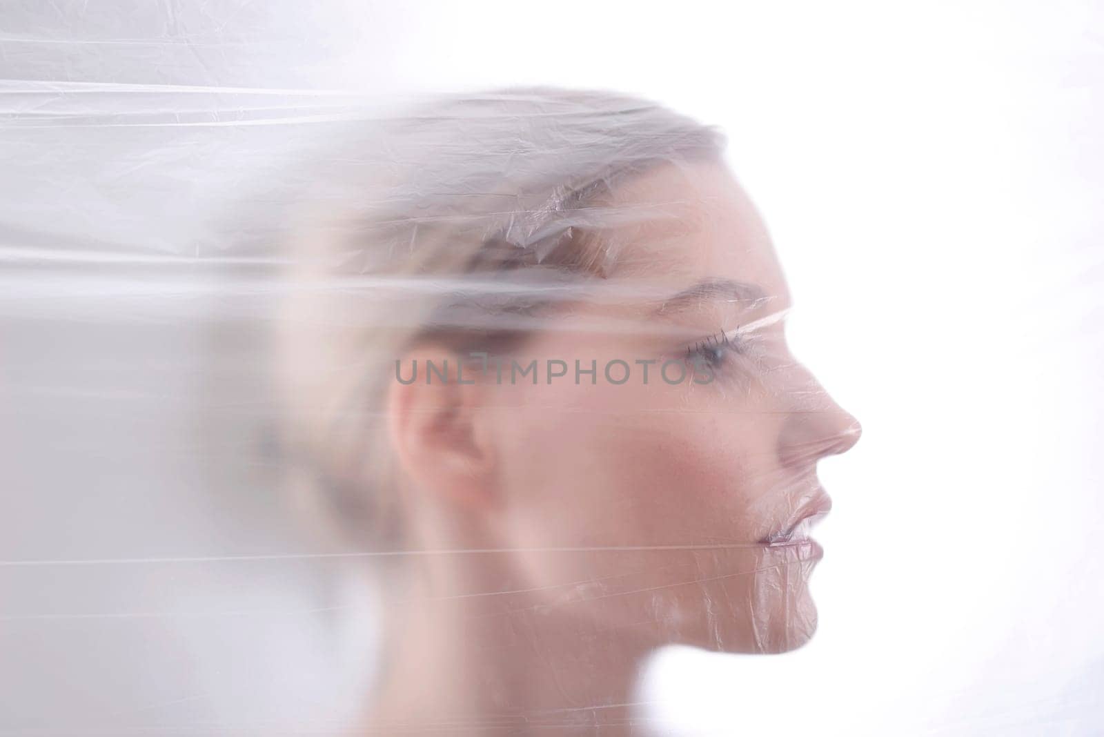 Woman behind foil