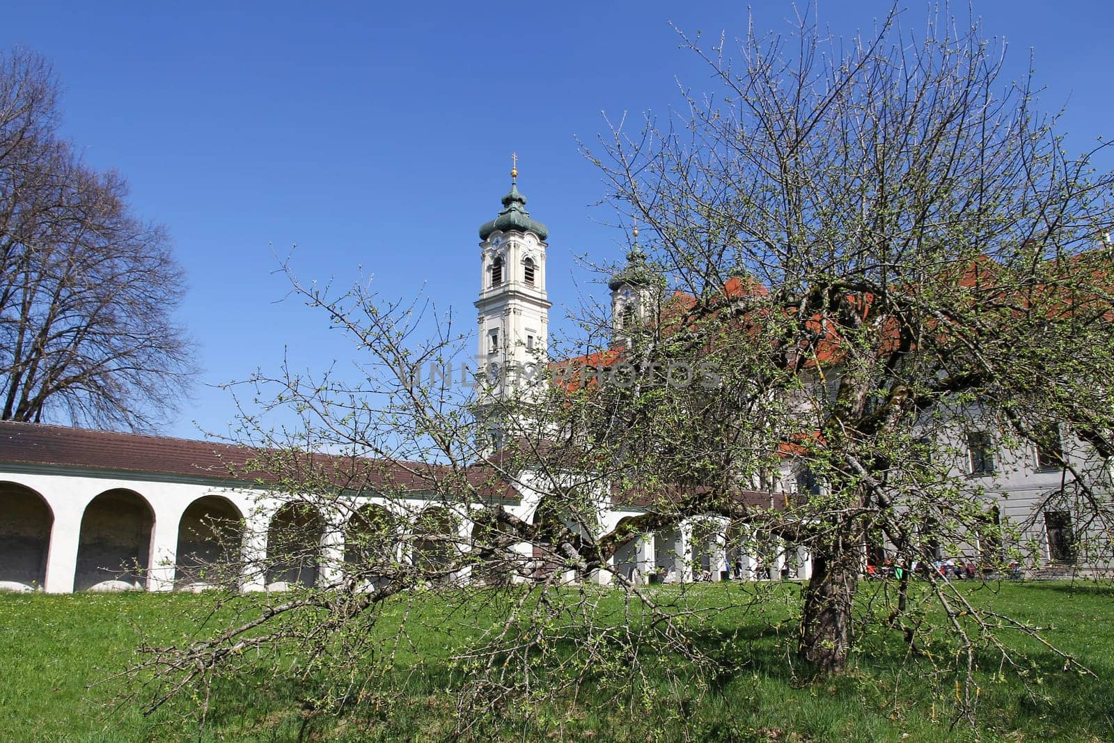Monastery garden of the Benedictine Abbey of Ottobeuren. The church and the garden of the monastery in Ottobeuren