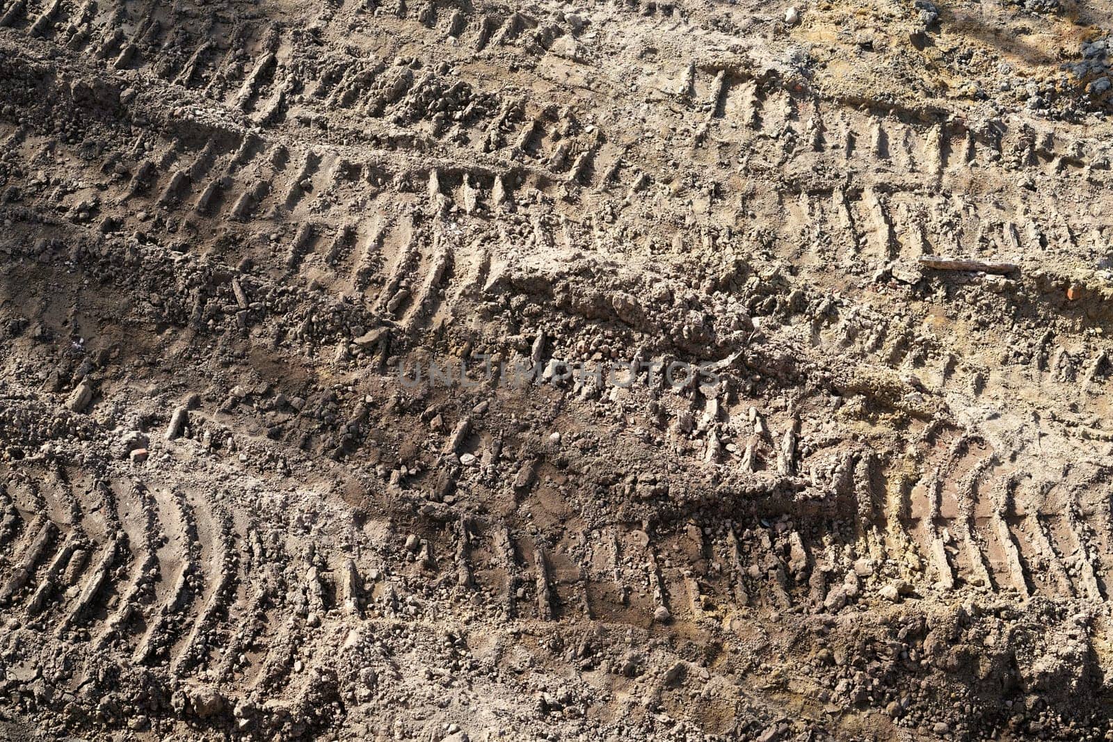 Tire tracks of construction vehicles on a construction site
