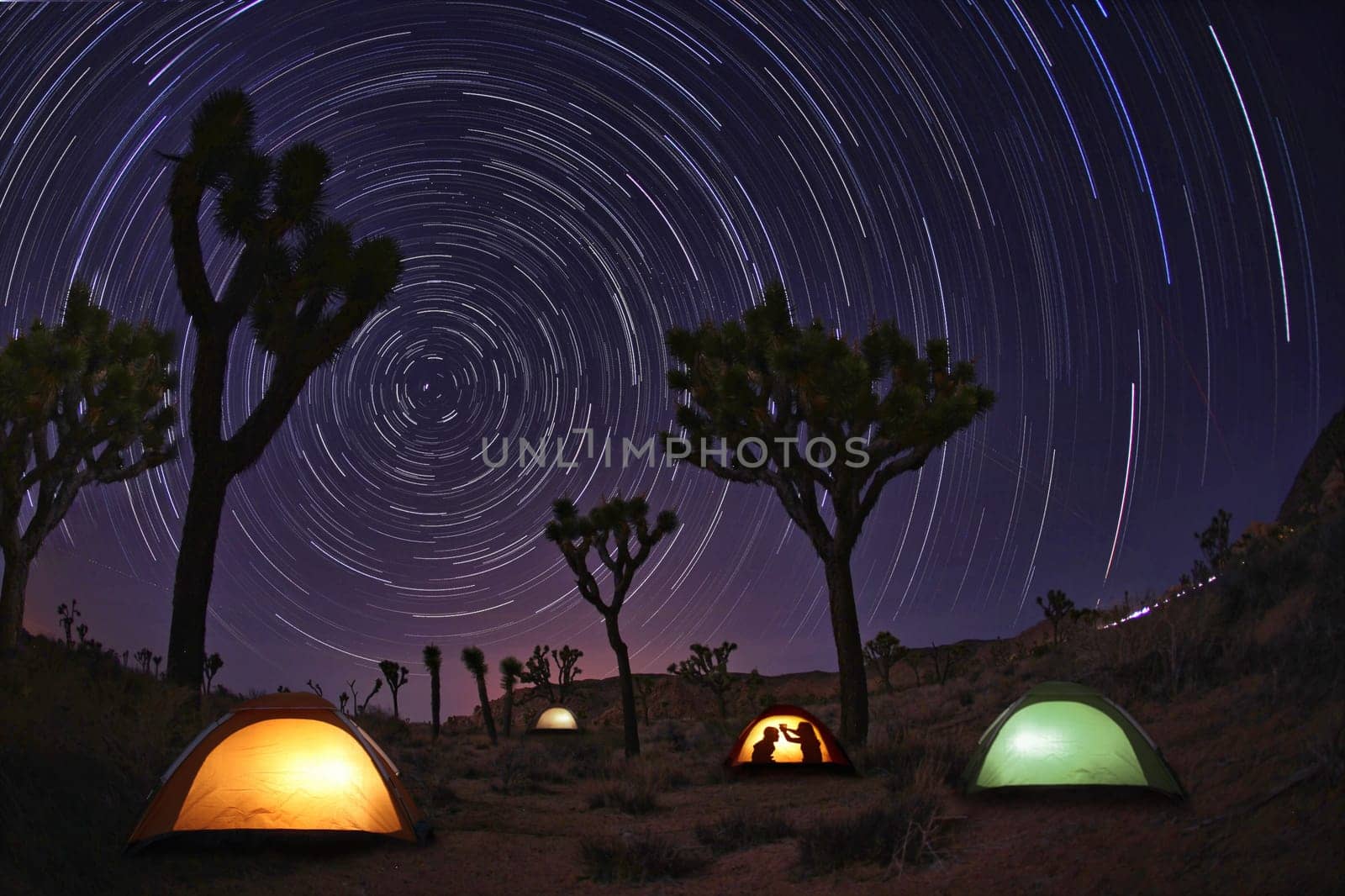 Illuminous Light Painted Landscape of Camping and Stars