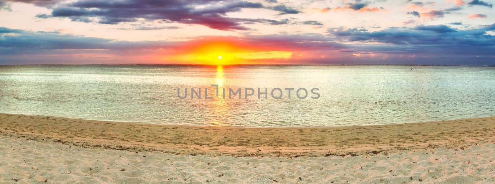 White sandy beach Le Morne at sunset. Mauritius. Panorama