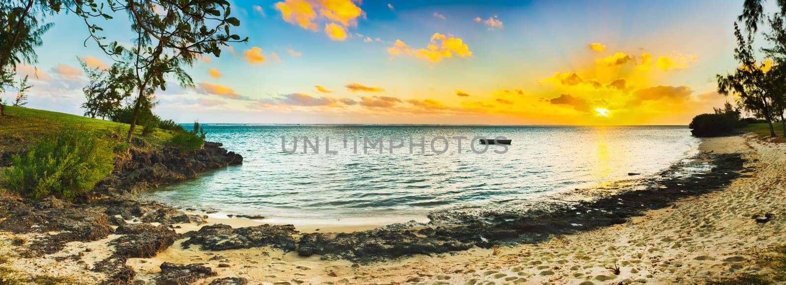 White sandy beach at sunset. Mauritius. Panorama