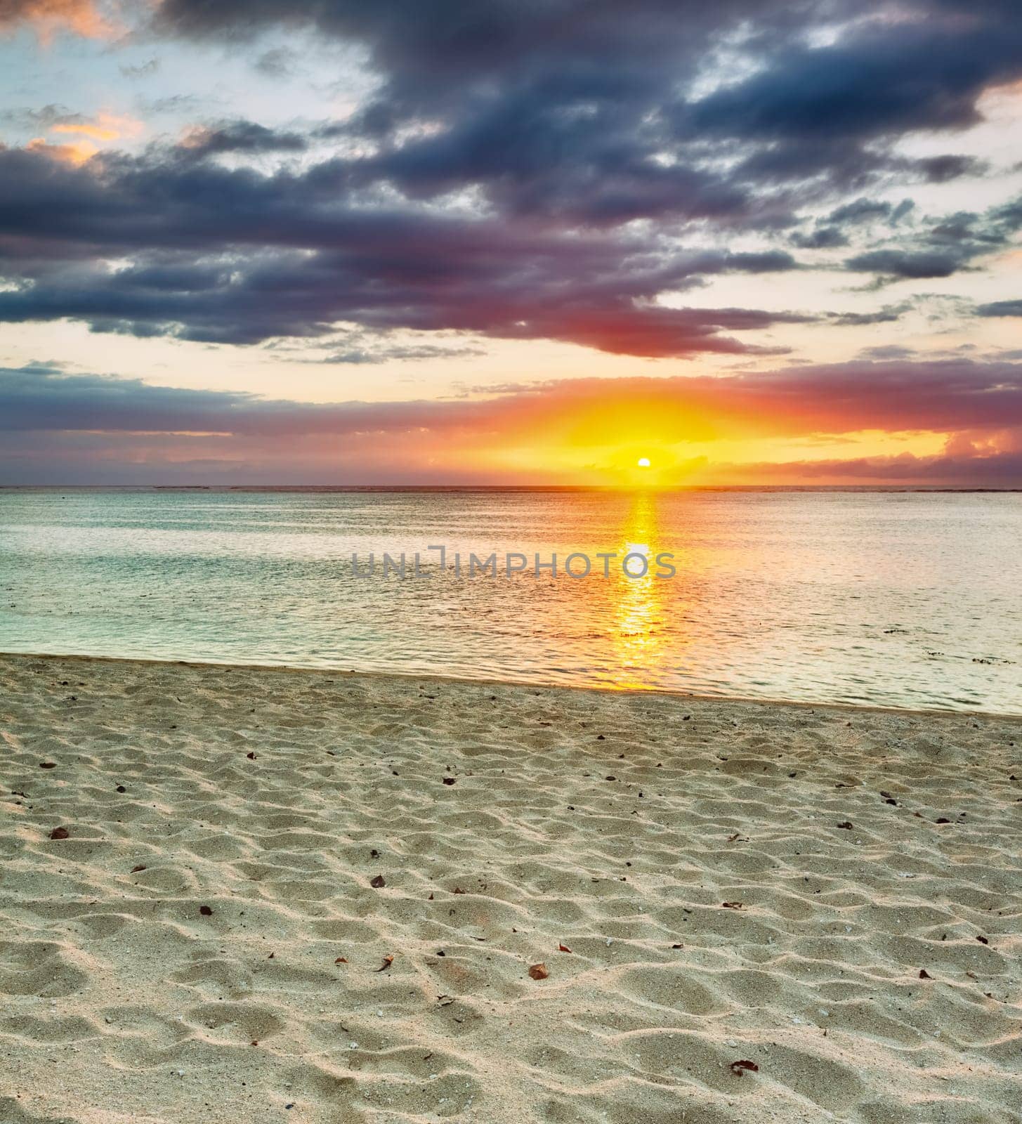 White sandy beach Le Morn  at sunset. Mauritius.