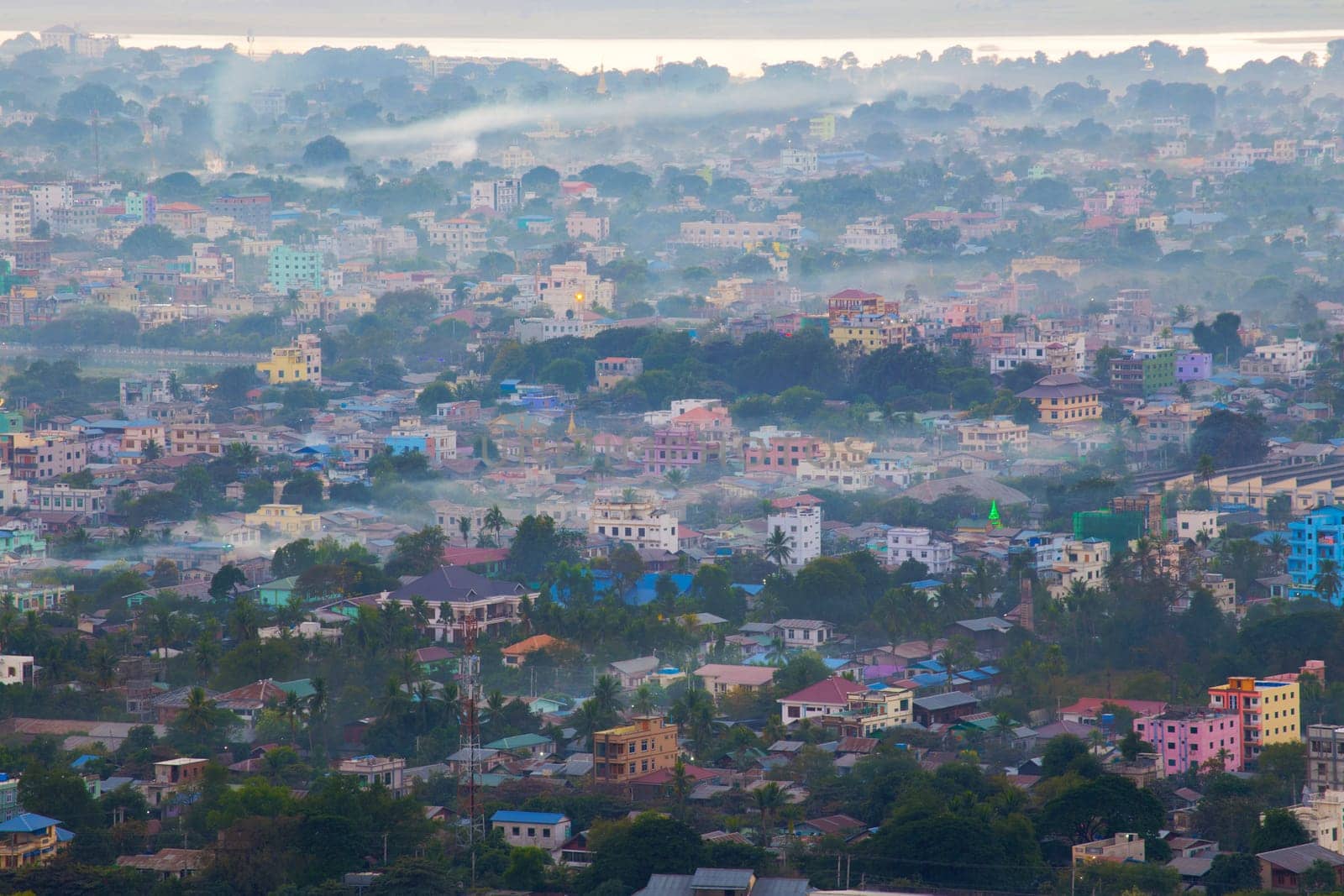 Mandalay with lake mountains, temples and pagodas seen from mandalay hill at sunset, Burma.