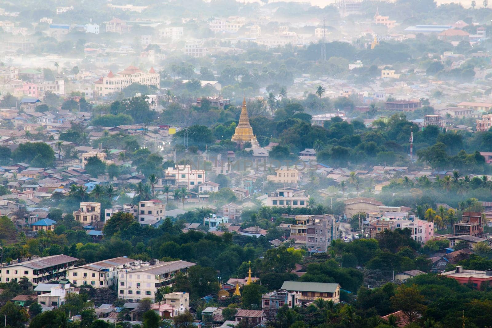 Mandalay with lake mountains, temples and pagodas seen from mandalay hill at sunset, Burma.