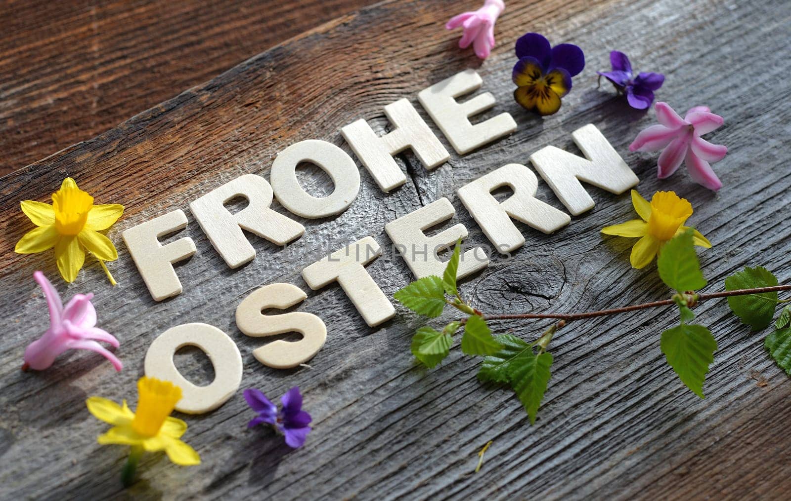 Happy Easter on a wooden background