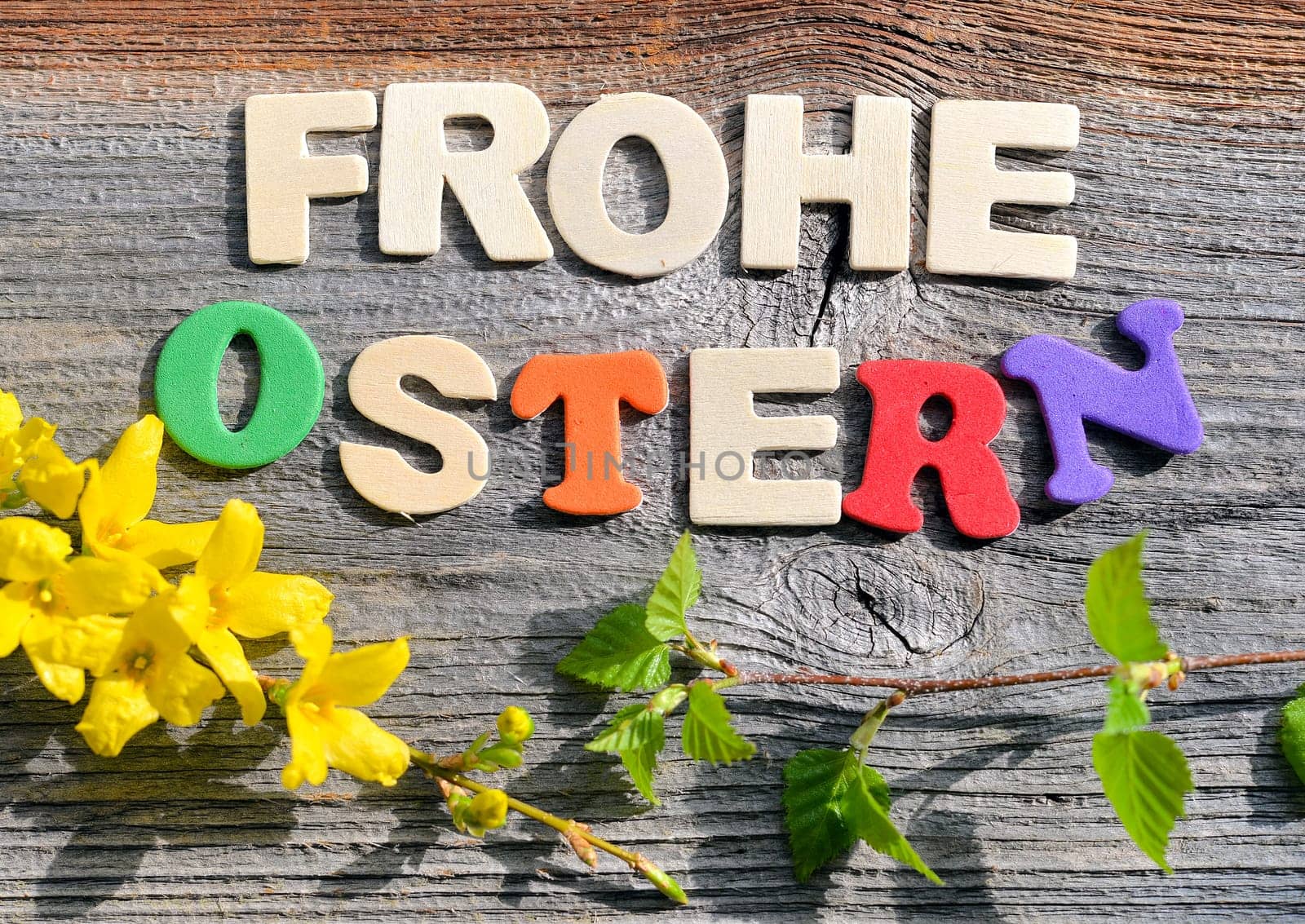 Happy Easter on a wooden background