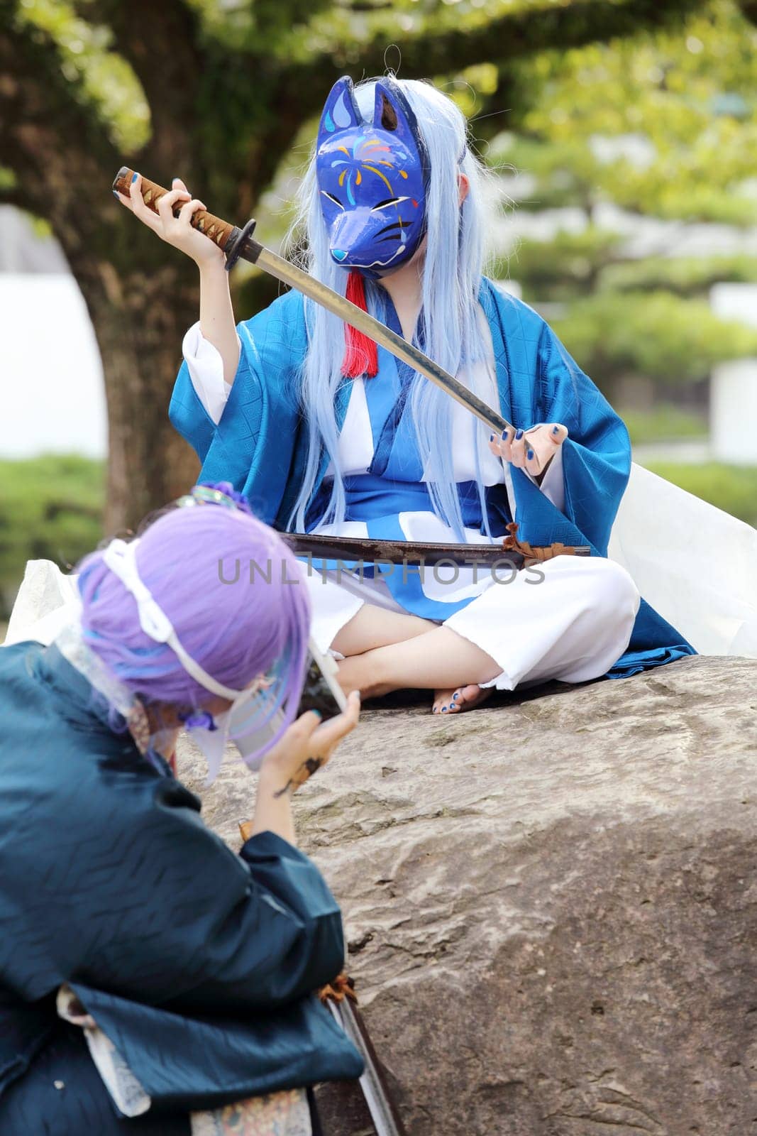 Kagawa, Japan - November 20, 2016: Young japanese girl dressed in cosplay costume at Mamugame-Jou Park. Photo taken in Marugame Cosplay Convention during a meeting of cosplayer.