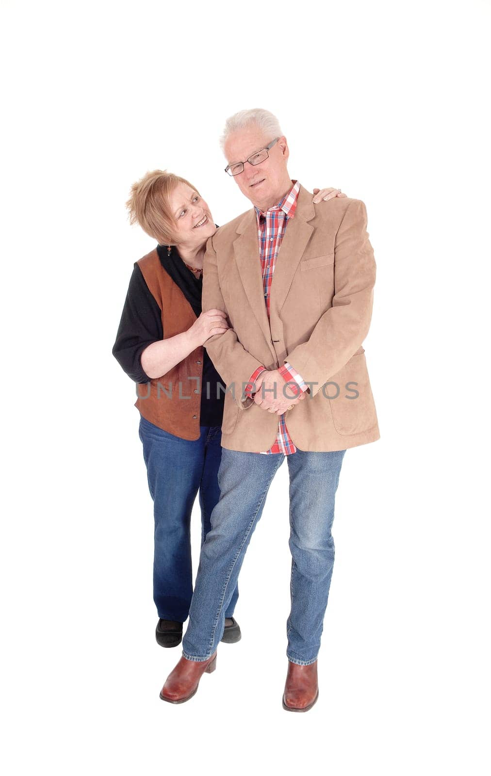 A lovely older couple standing in casual cloth, hugging each other, .smiling, isolated for white background..