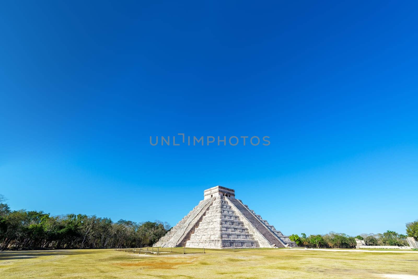 Wide angle view of the pyramid in the Mayan ruins of Chichen Itza in Mexico