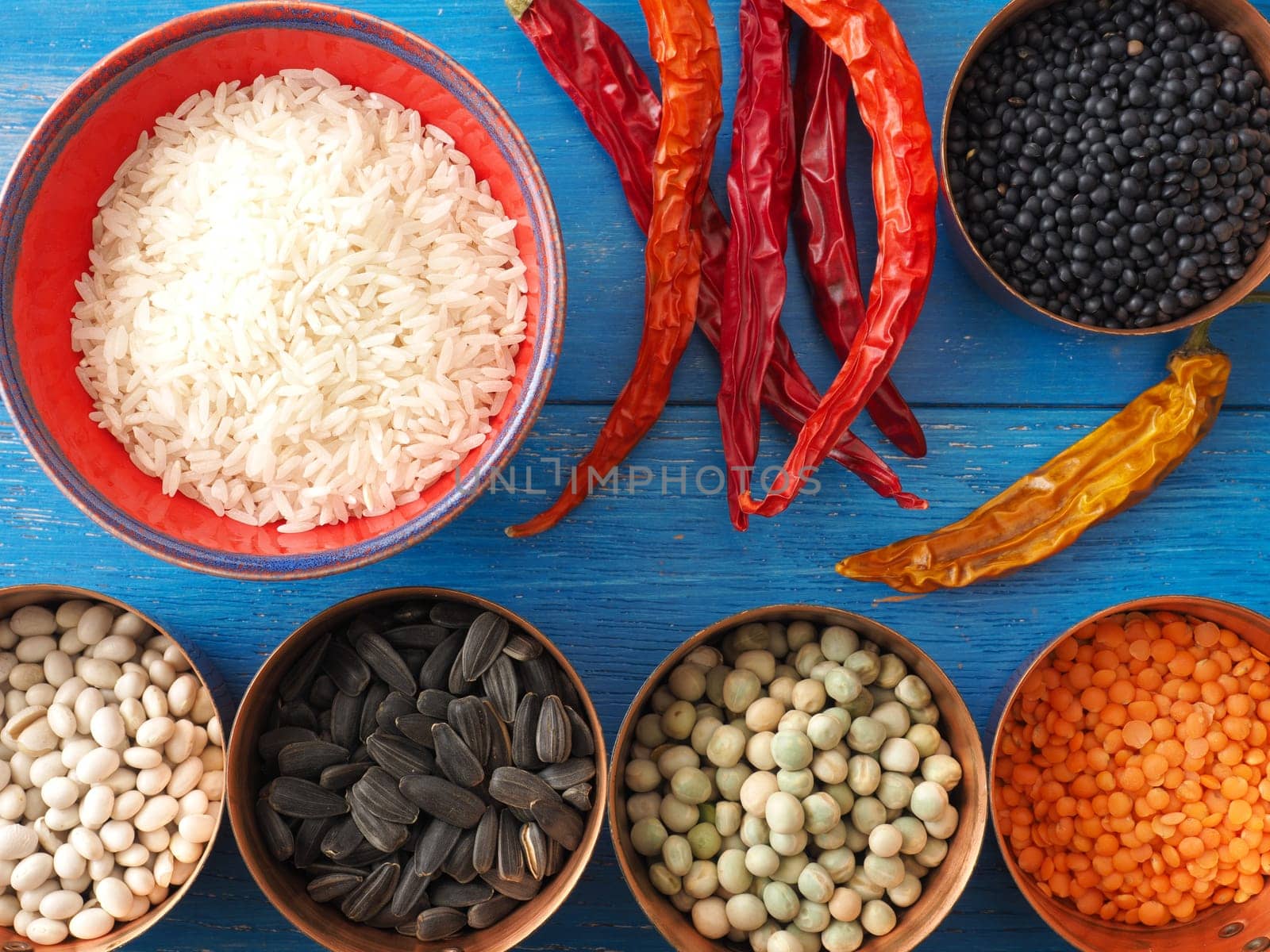 Colorful food ingredients on a blue wooden kitchen table