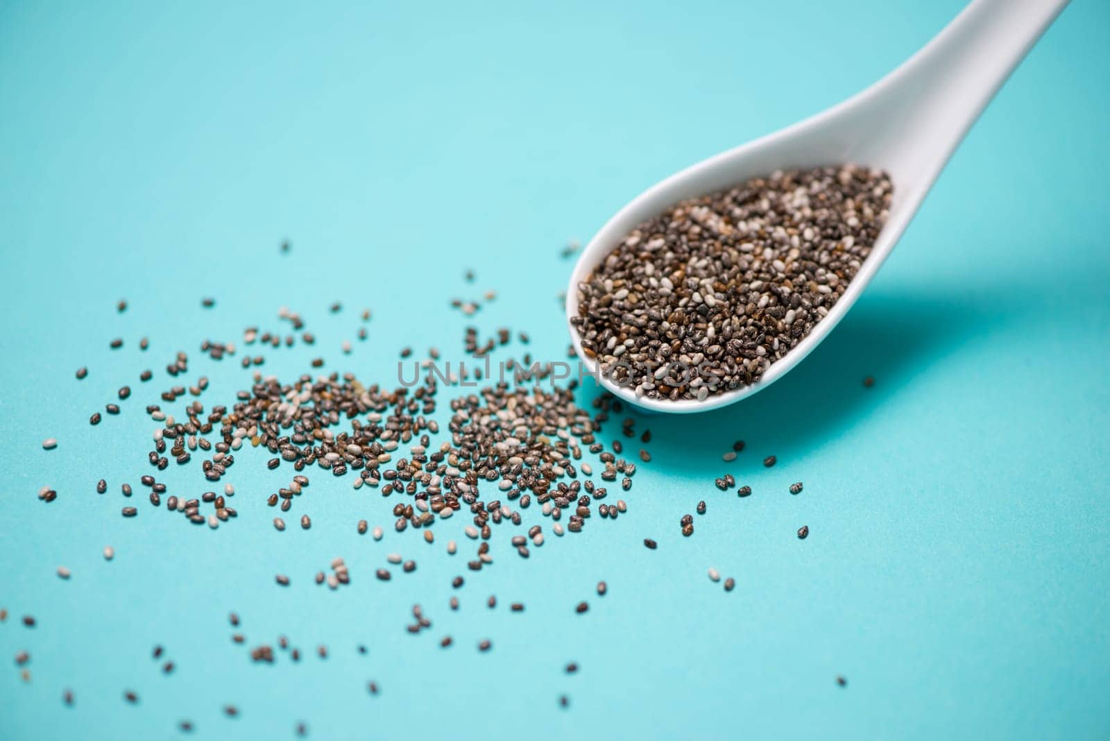 Close-up of ealthy chia seeds in a spoon. Text space.