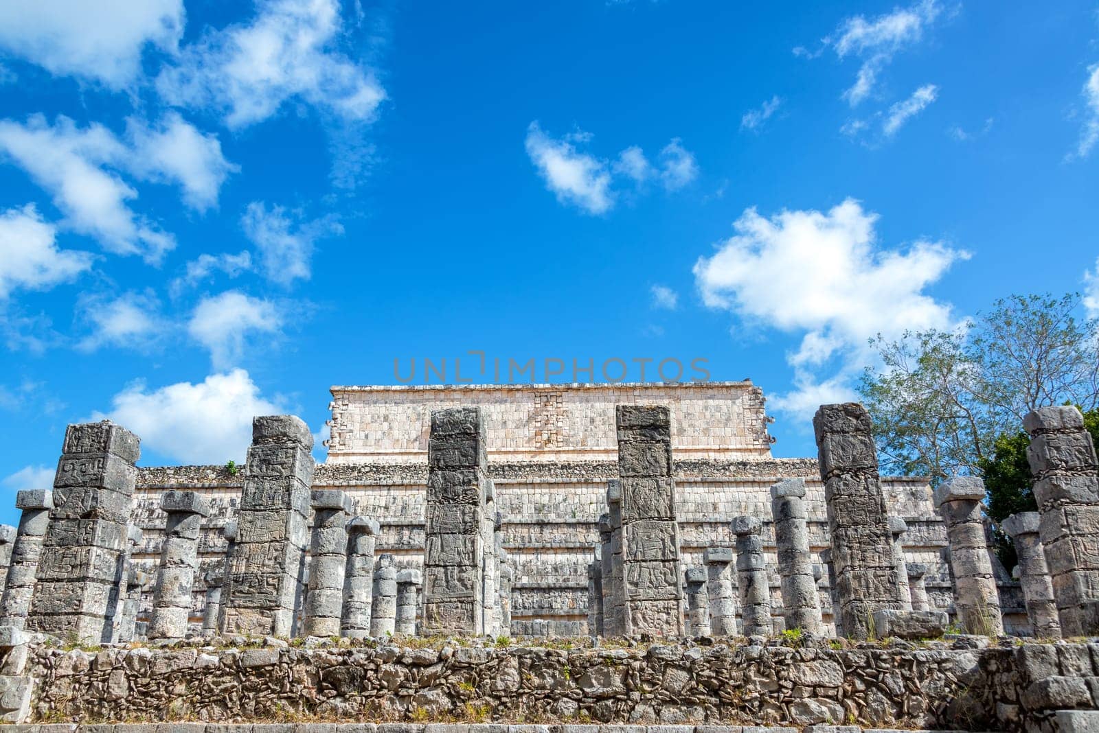 Plaza of the Thousand Columns with the Temple of the Warriors in the background in the ruins of Chichen Itza, Mexico