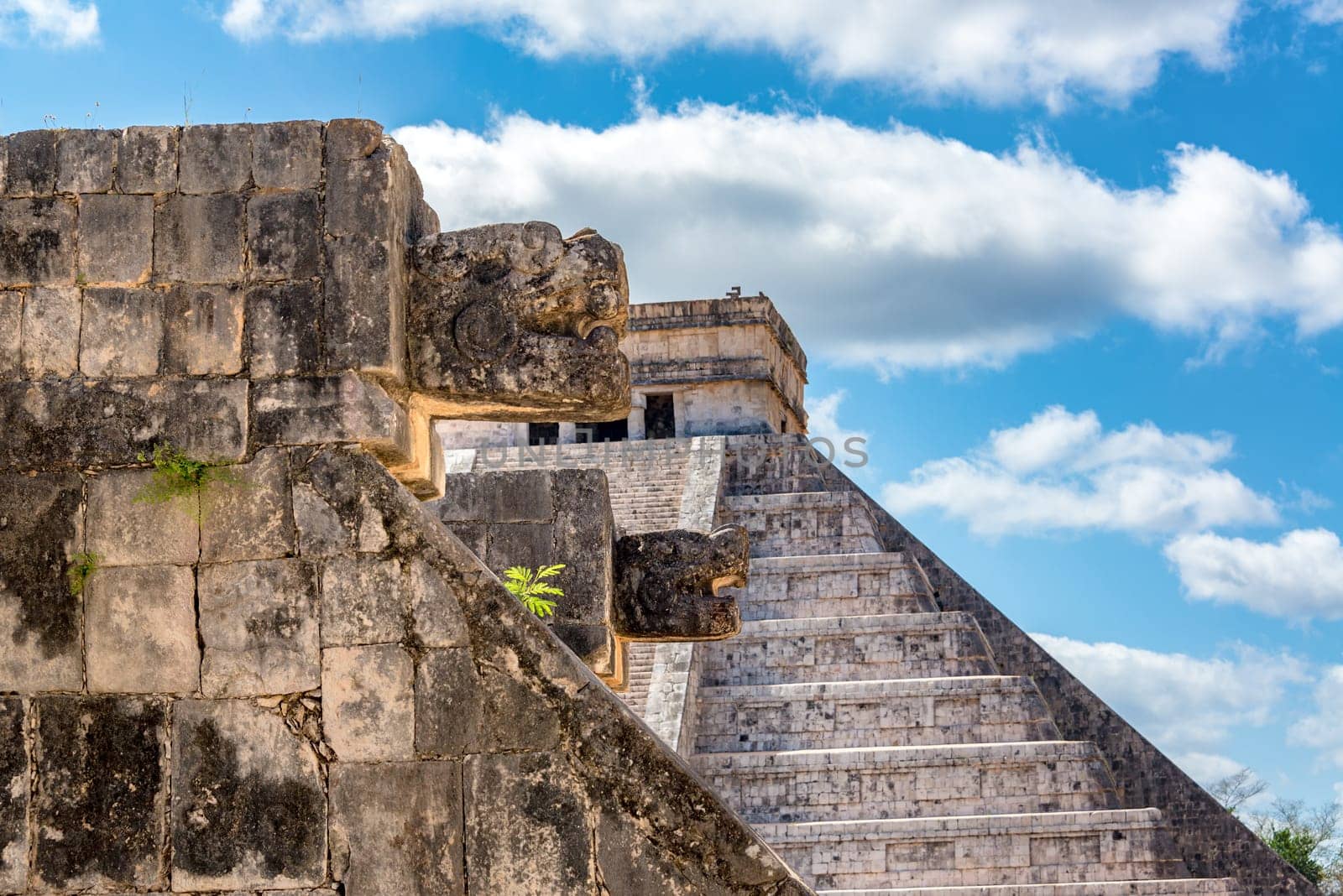 View of the Venus Platform with the Pyramid of Kukulcan visible in the background in the ruins of Chichen Itza in Mexico