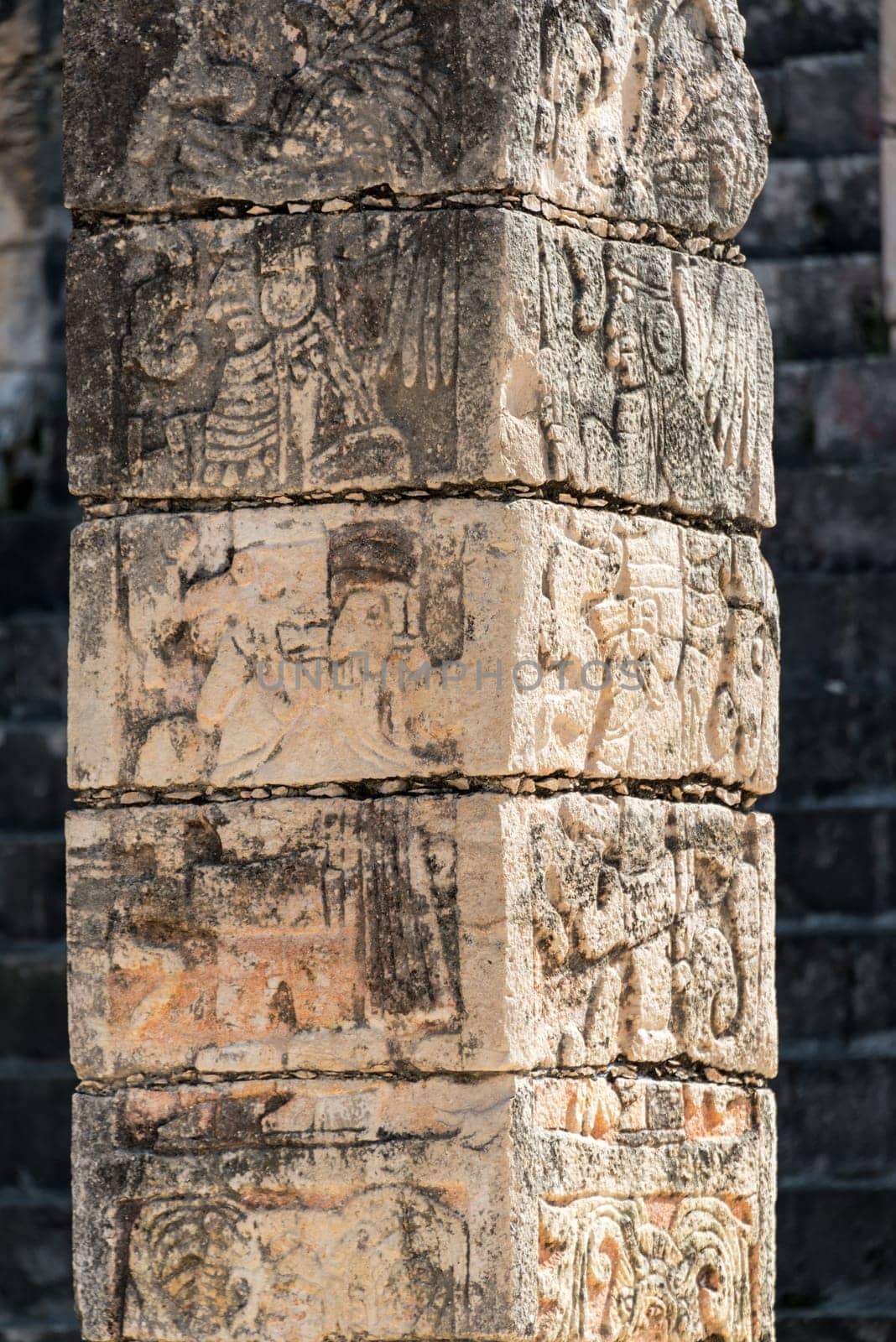 Ornately carved column in the ruins of the once great Mayan city of Chichen Itza in Mexico