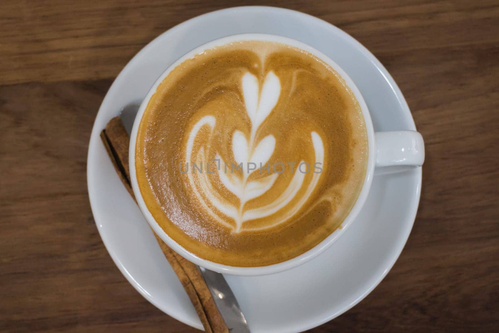 Coffee With Latte Art On Wooden Table, stock photo