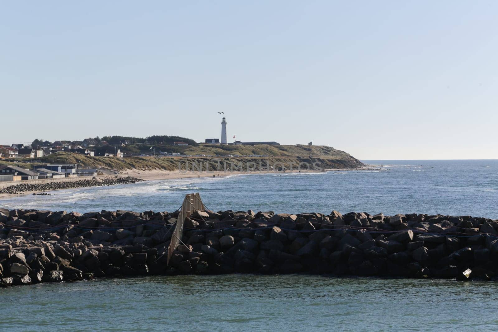 The coastline of Hirtshals and a lighthouse in the background.