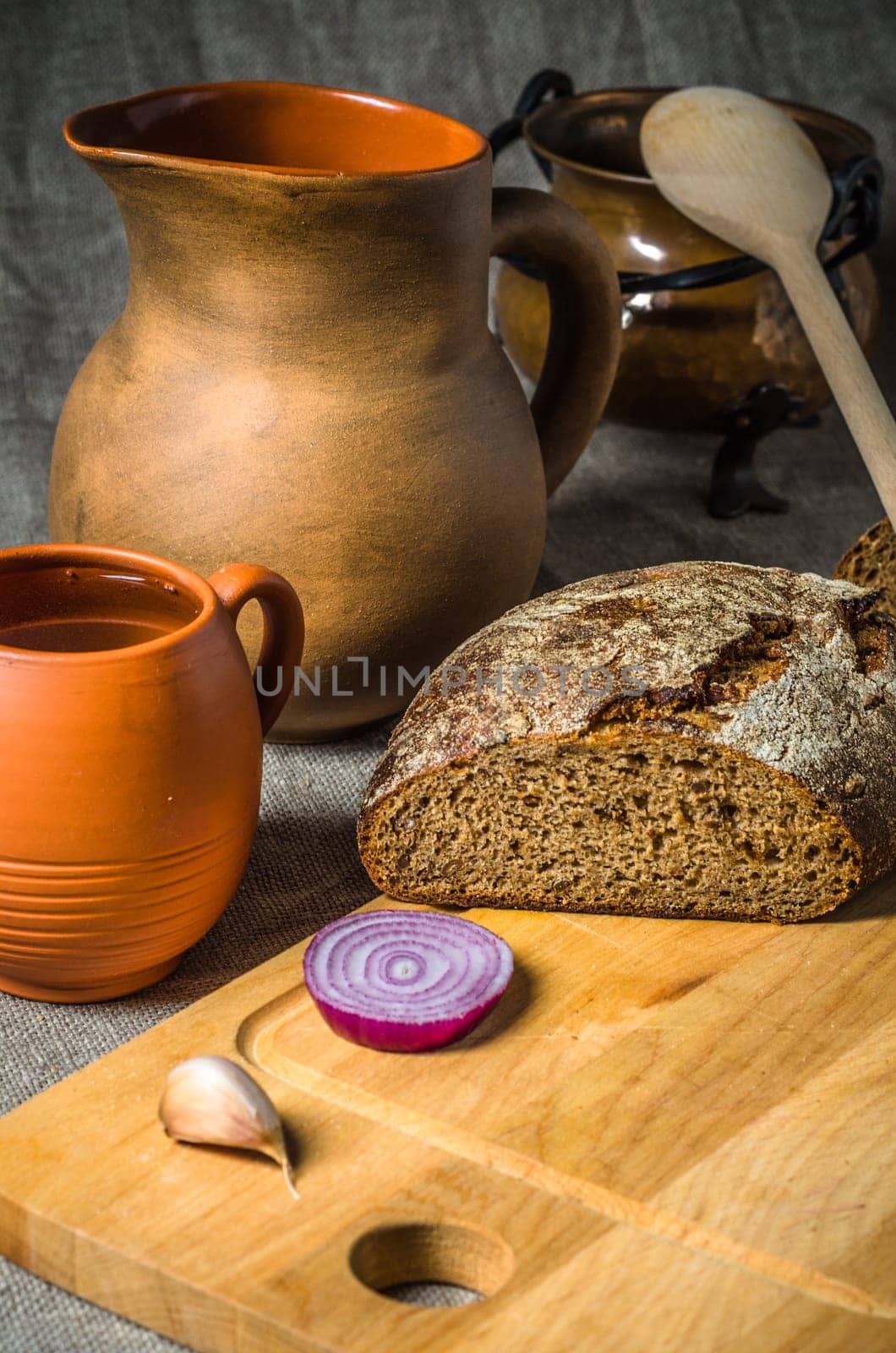 Still life with homemade bread and pottery