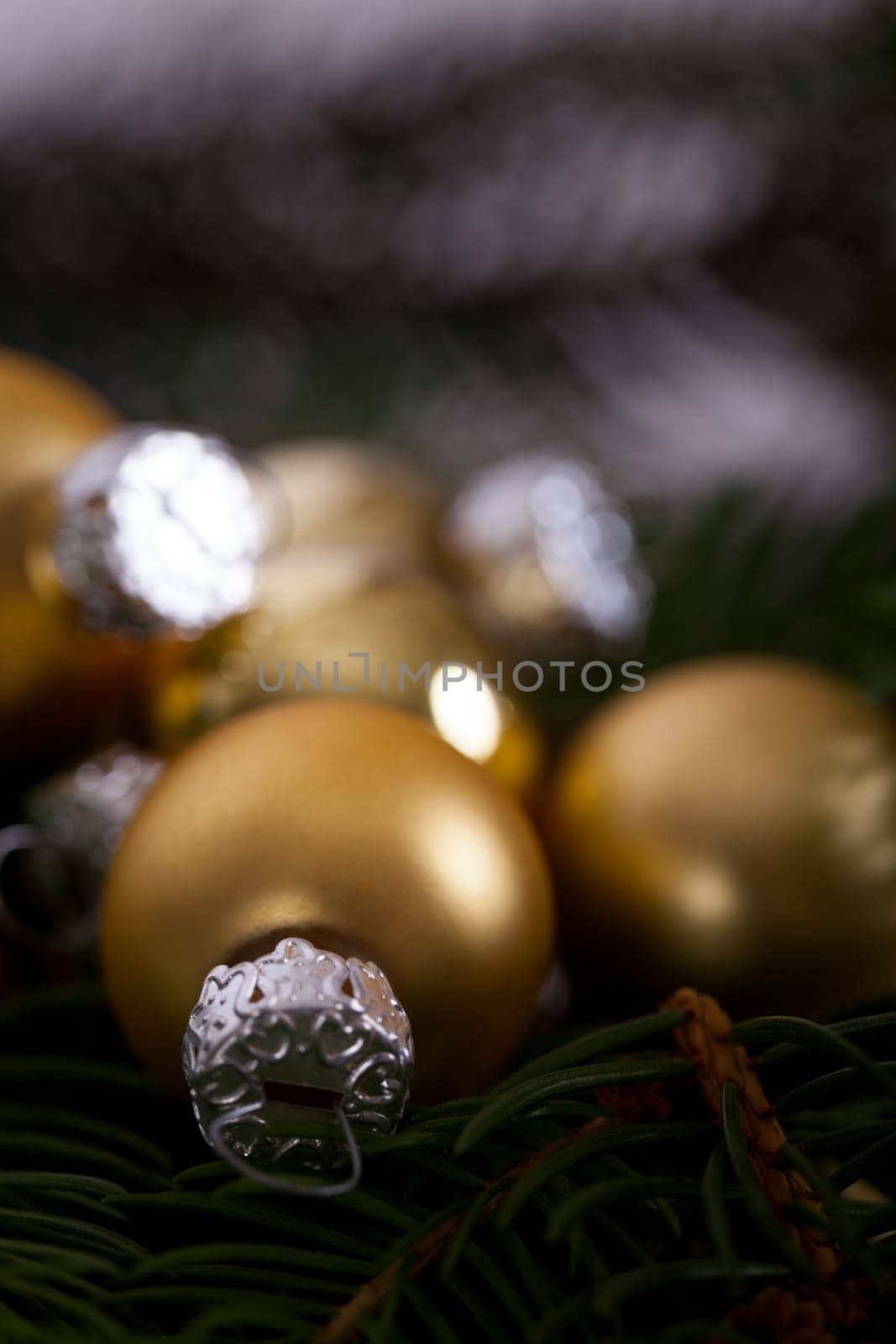 Golden shiny Christmas tree decoration Advebtsschmuck on green fir branches as close-up