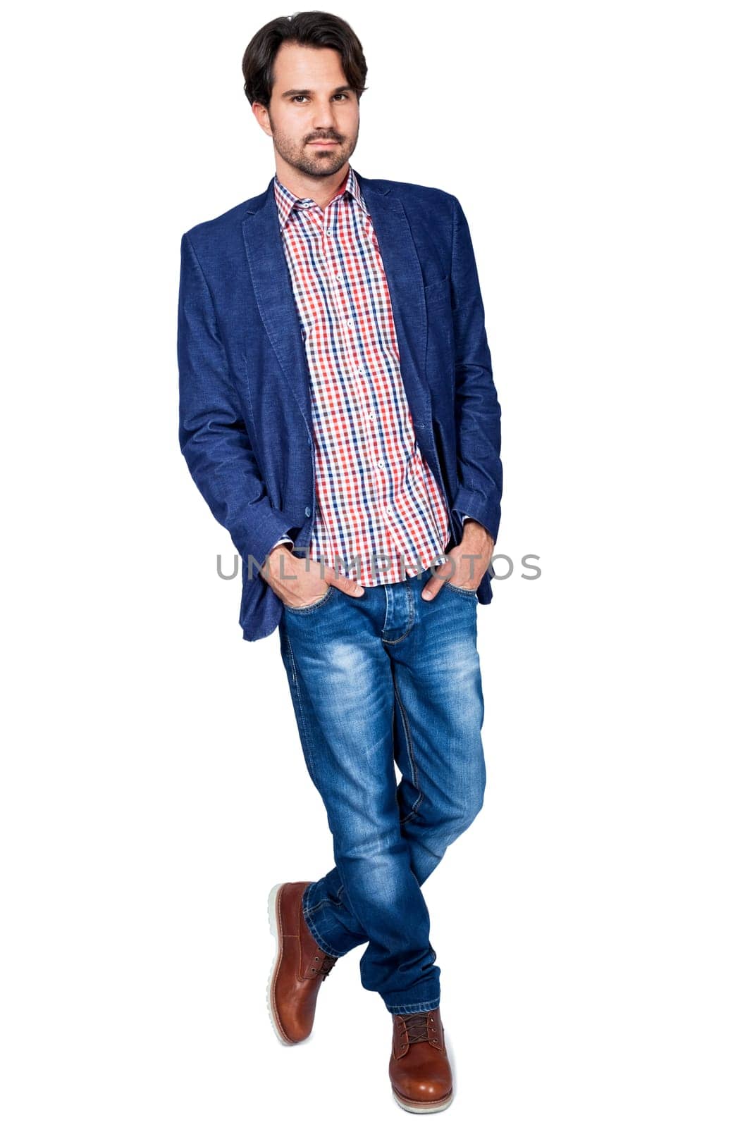 Young man in trendy casual look with dark hair and beard isolated against a white background