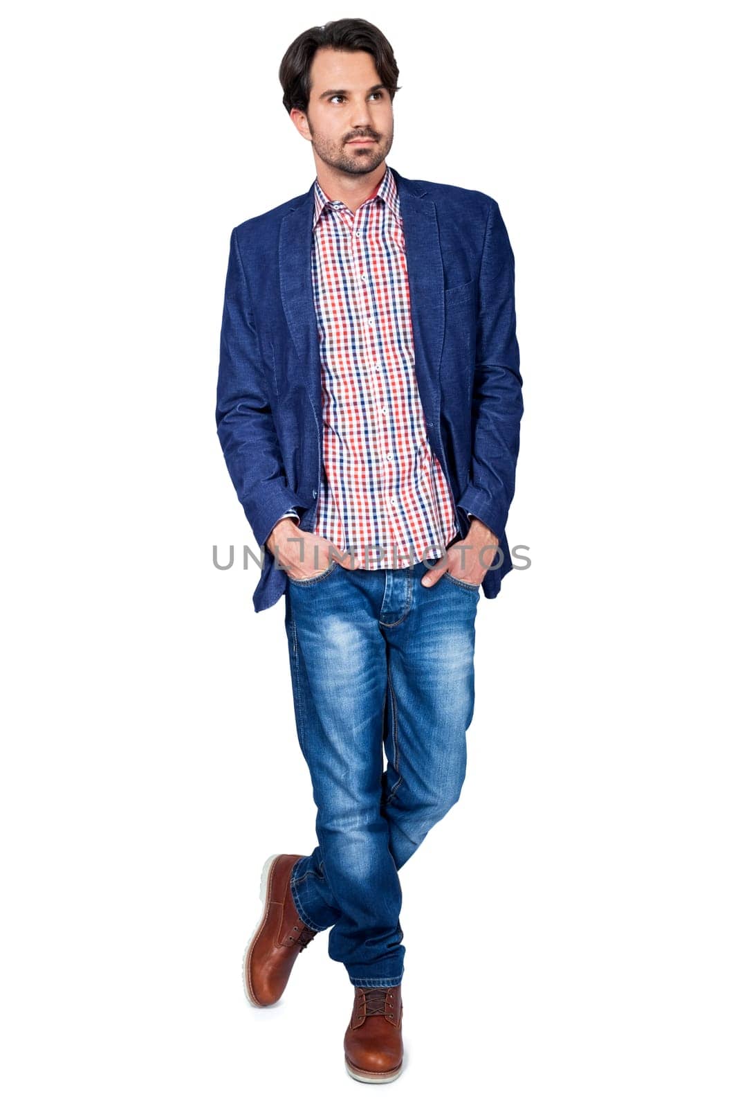 Young man in trendy casual look with dark hair and beard isolated against a white background