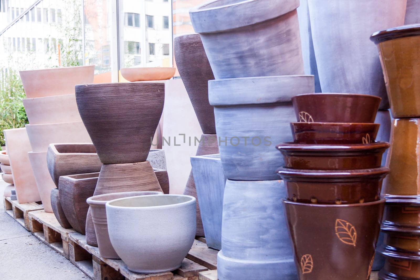 Flower pots made of stone Glazed and unglazed in retail outdoors