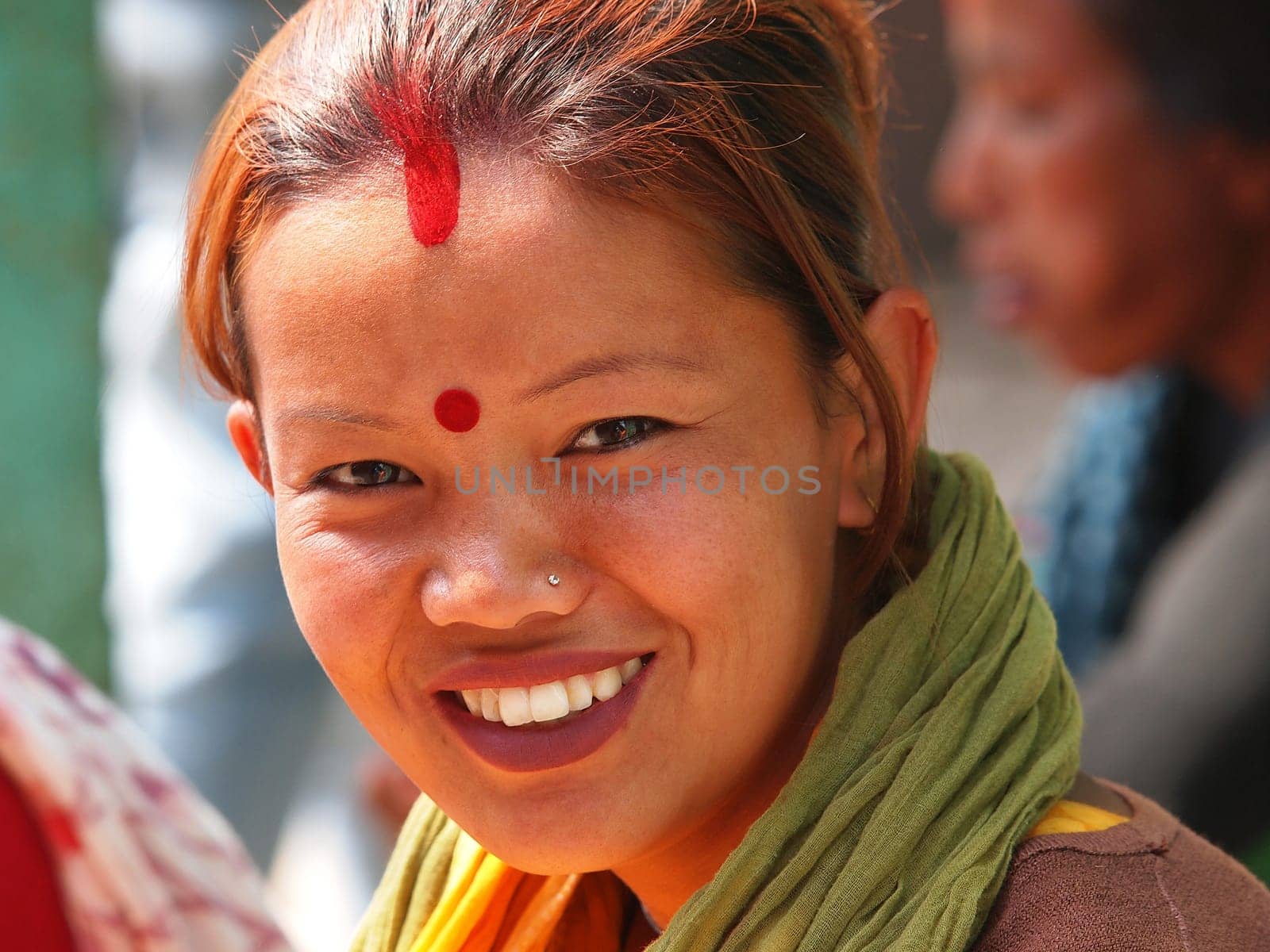 young girl from Nepal with red hear