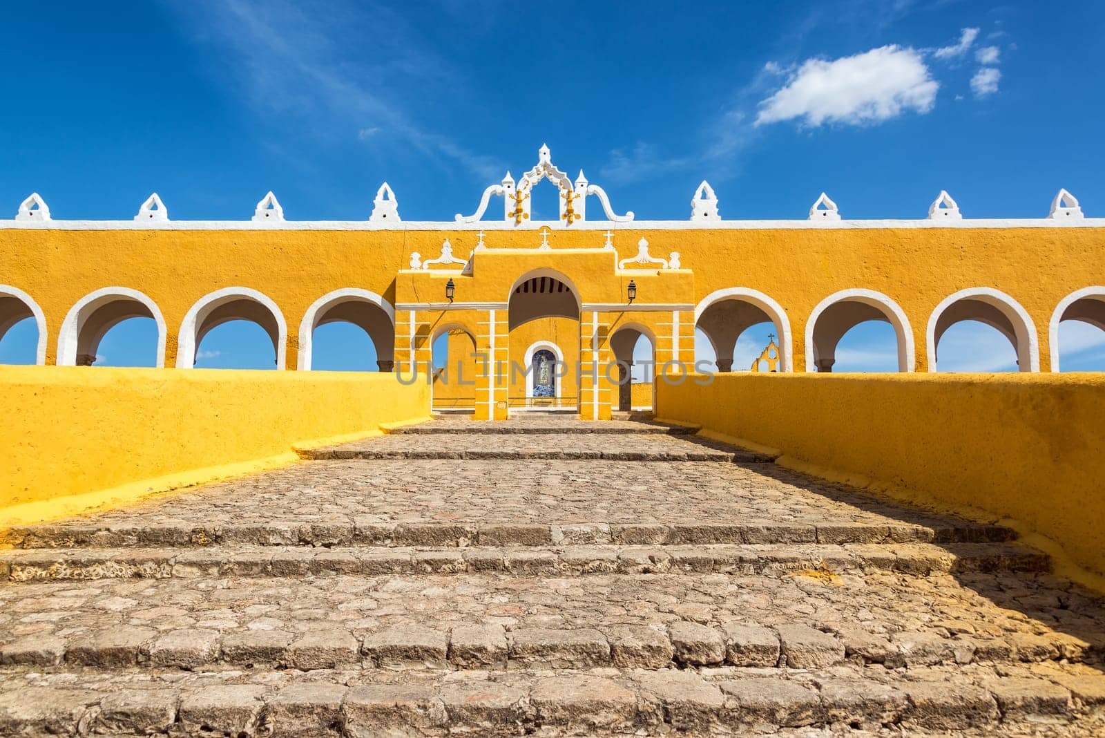 Path leading up to the entrance of the colonial monastery in Izamal, Mexico