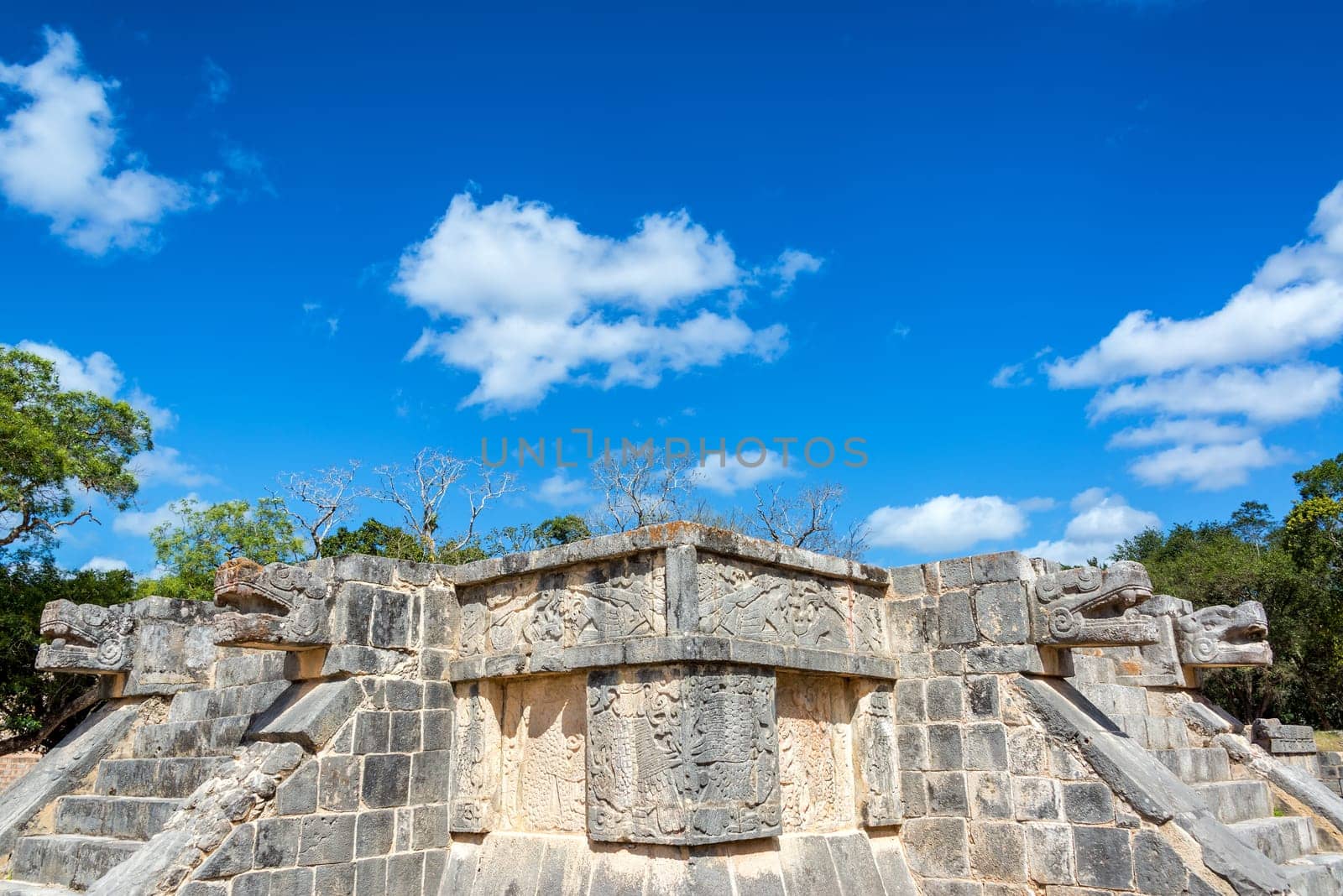 Platform of the Eagles and Jaguars with a beautiful blue sky in the ruins of Chichen Itza in Mexico