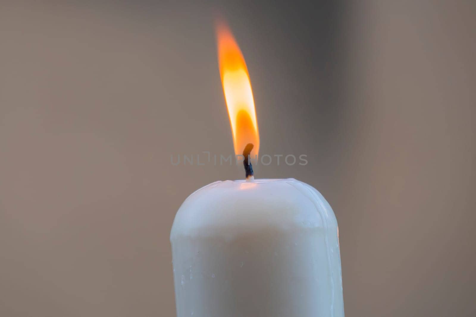 White candle with the flame