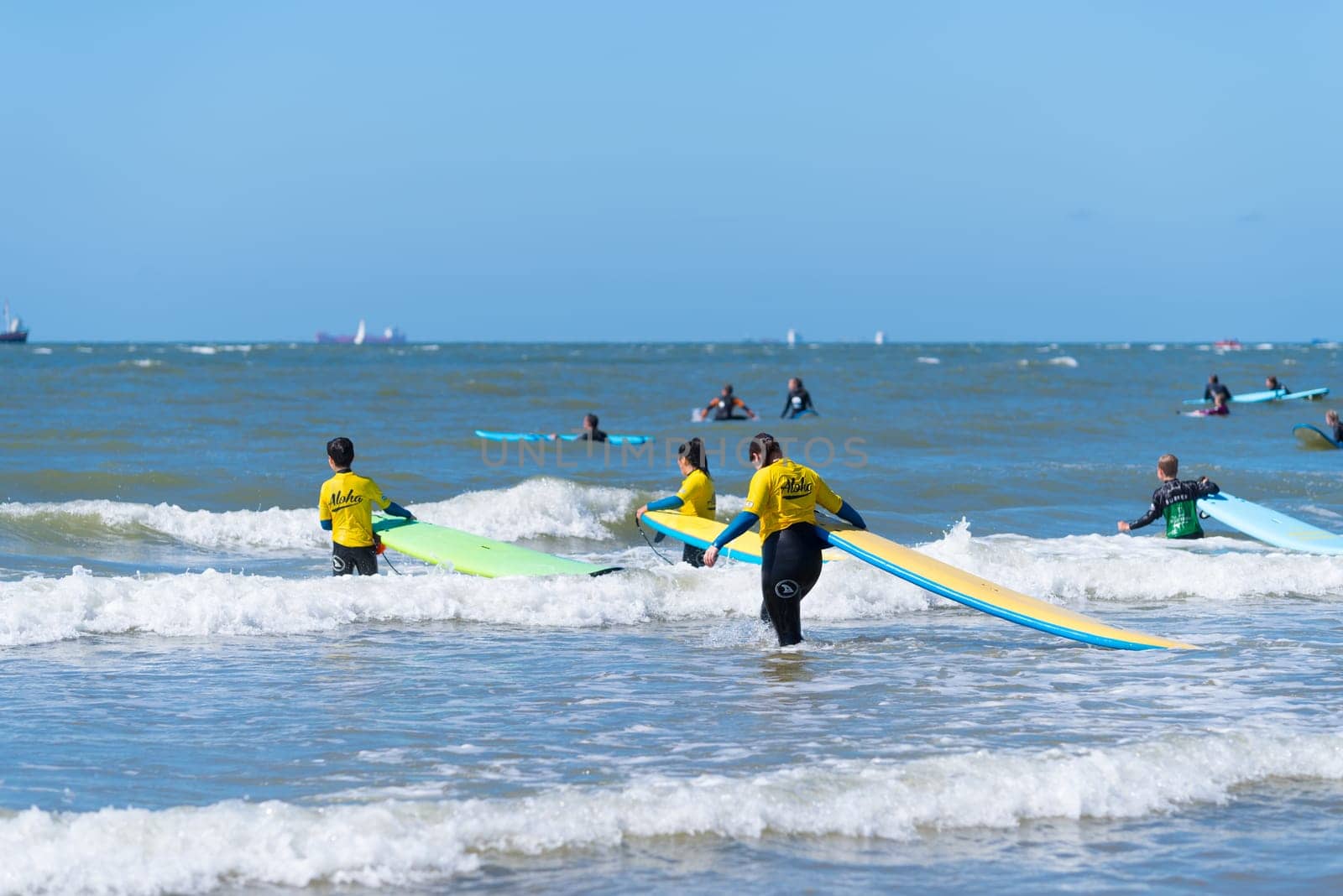 SCHEVENINGEN, NETHERLANDS - JULY 3, 2016: Surf school students in action on the dutch North Sea coast