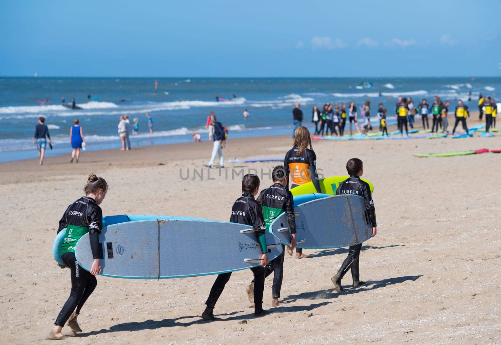 SCHEVENINGEN, NETHERLANDS - JULY 3, 2016: Surf school students in action on the dutch North Sea coast