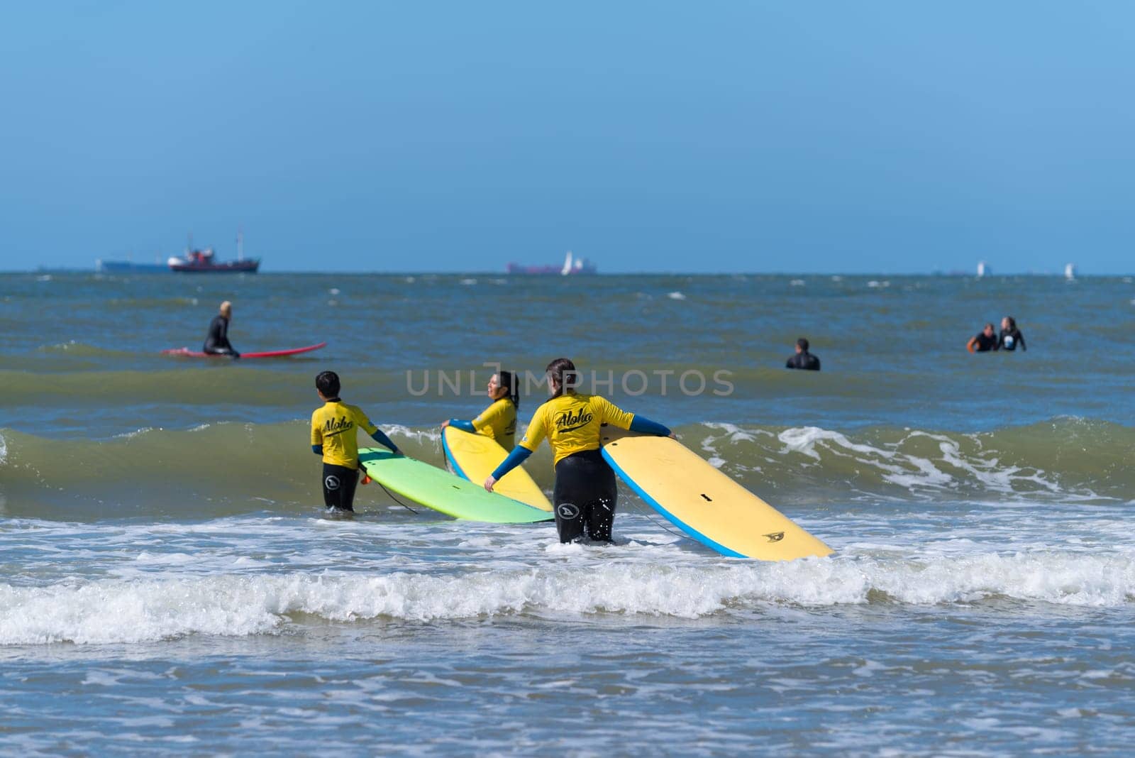 SCHEVENINGEN, NETHERLANDS - JULY 3, 2016: Surf school students in action on the dutch North Sea coast