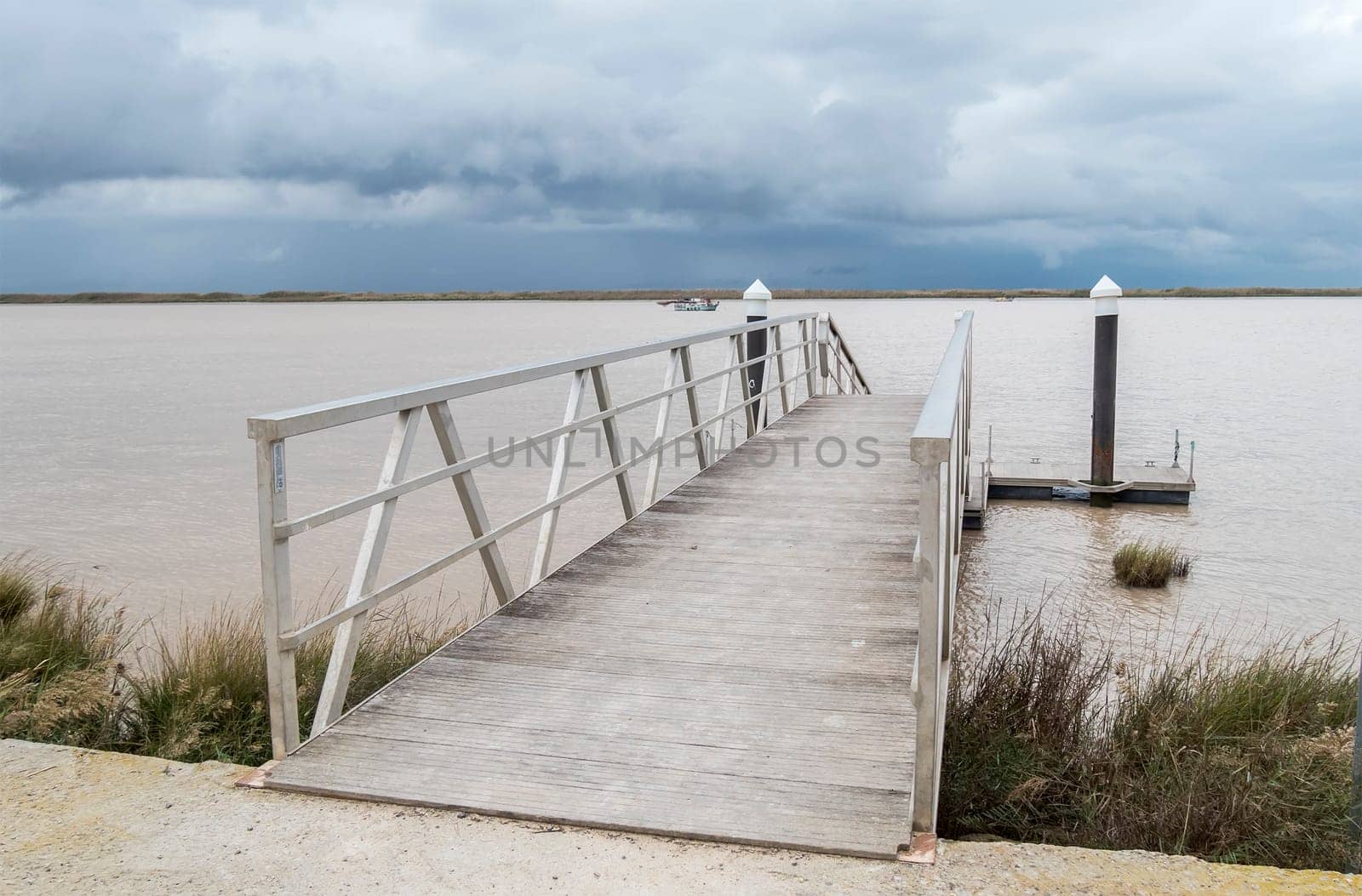 Wooden pier river on a cloudy day