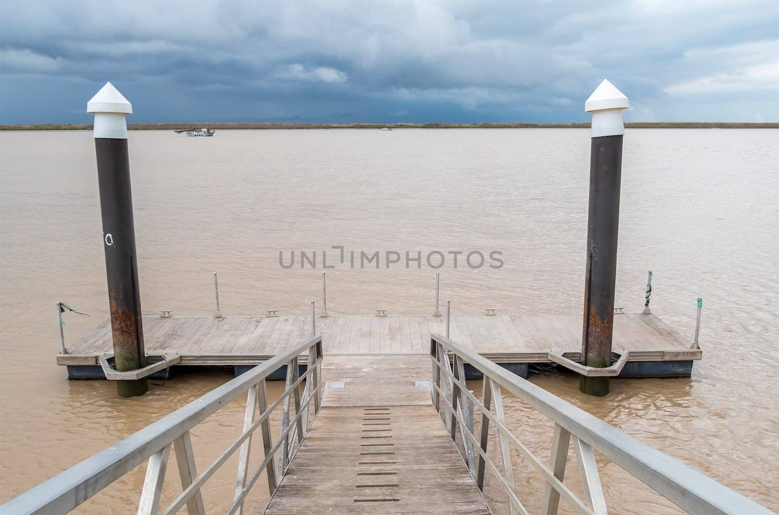 Wooden pier river on a cloudy day