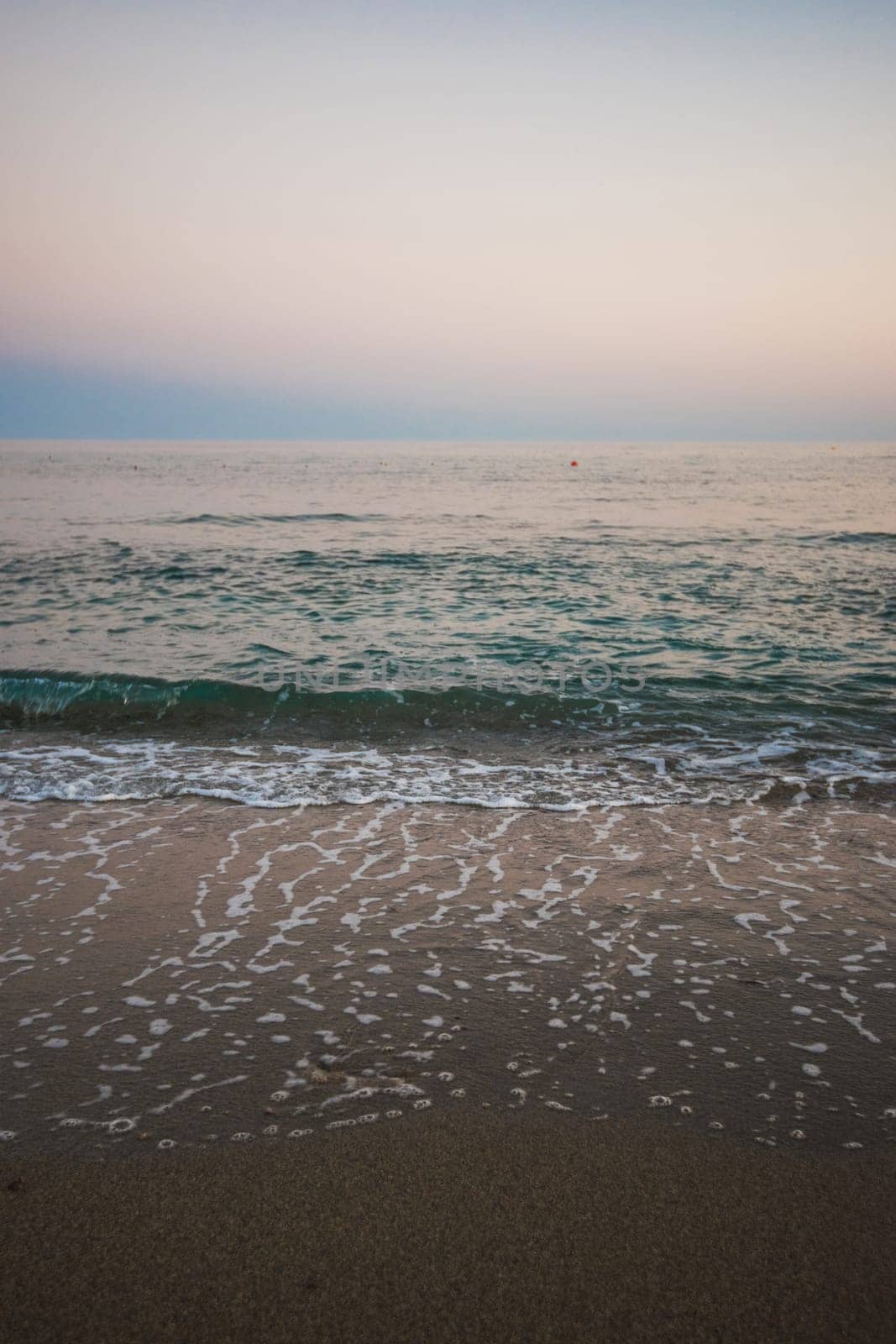 Blue sea with waves in the evening