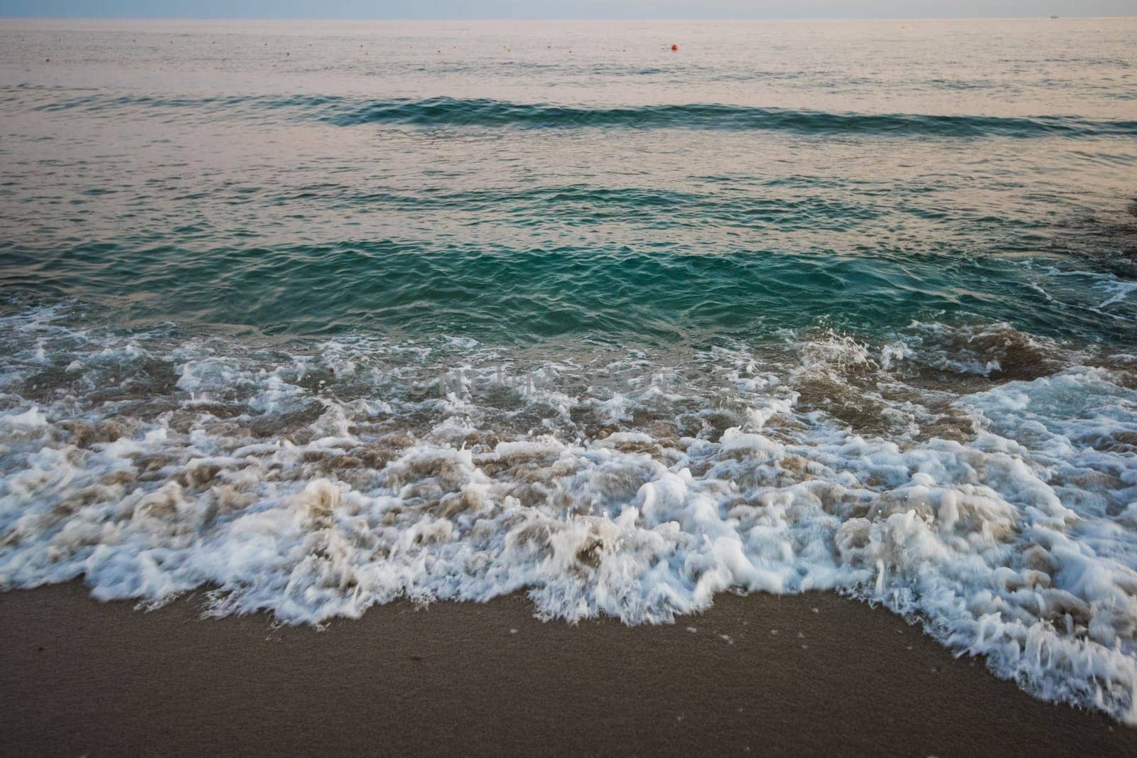 Blue sea with waves in the evening